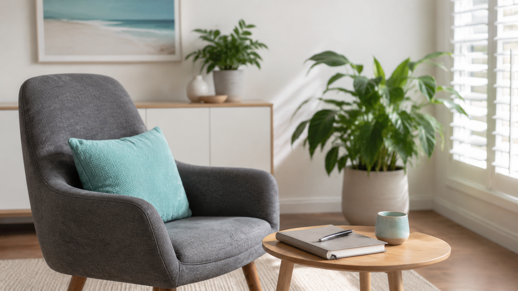 Calm desk with a planner and notebook in a light-filled consultation space.