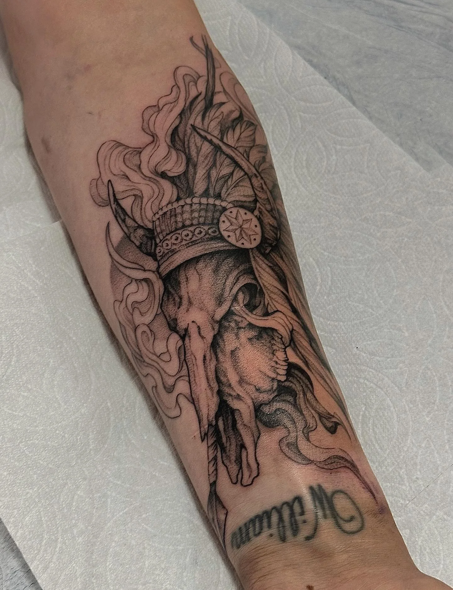 We did this bull skull inspired by this incredible book Blood Meridian. We have the smoke and, headress and that setting sun in the background. Ive missed doing skulls so much, and this tattoo inspired me to read the book which was chefs kiss. 
Thank