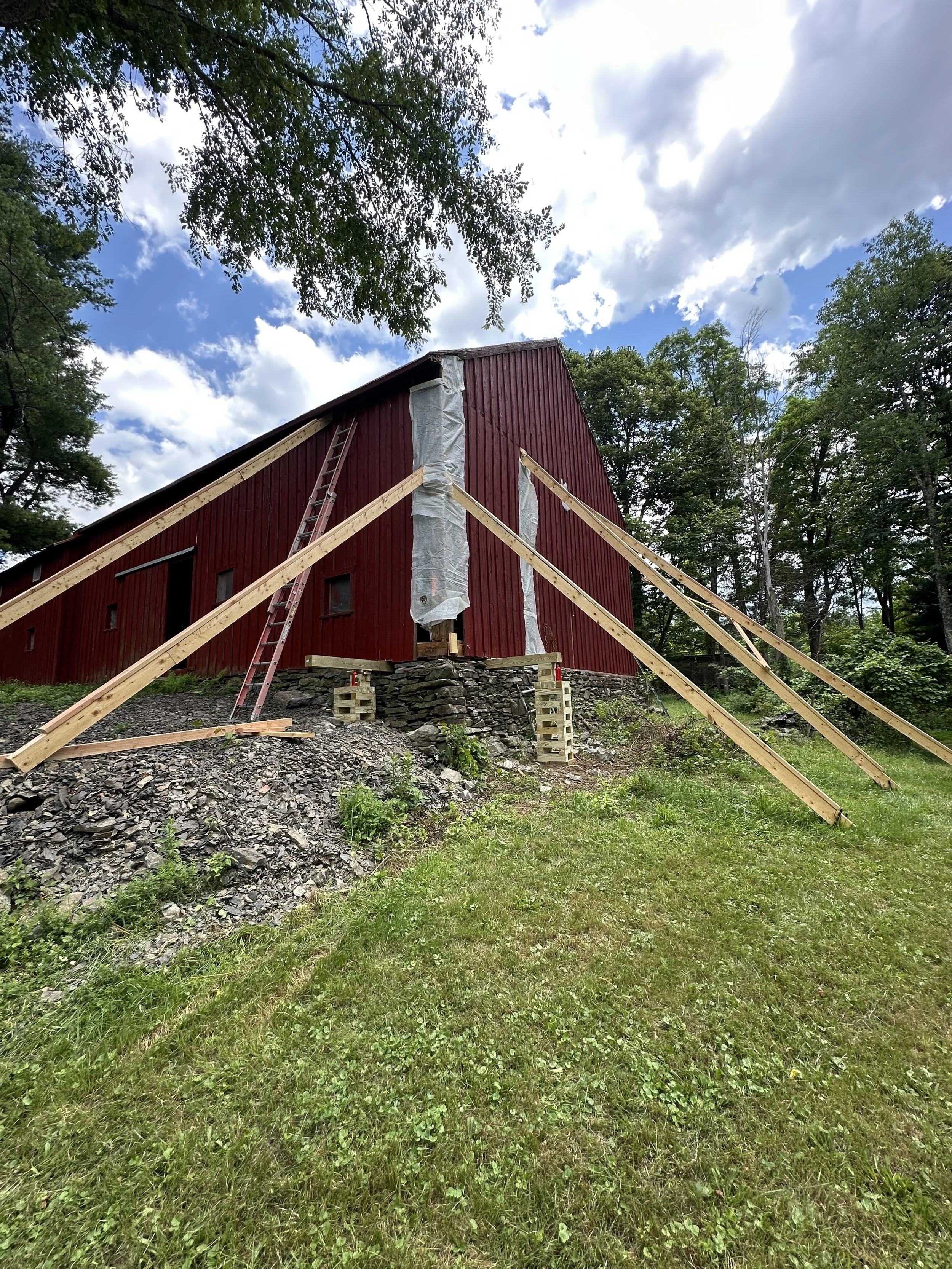Supports on corner of barn for lifting and foundation repair.