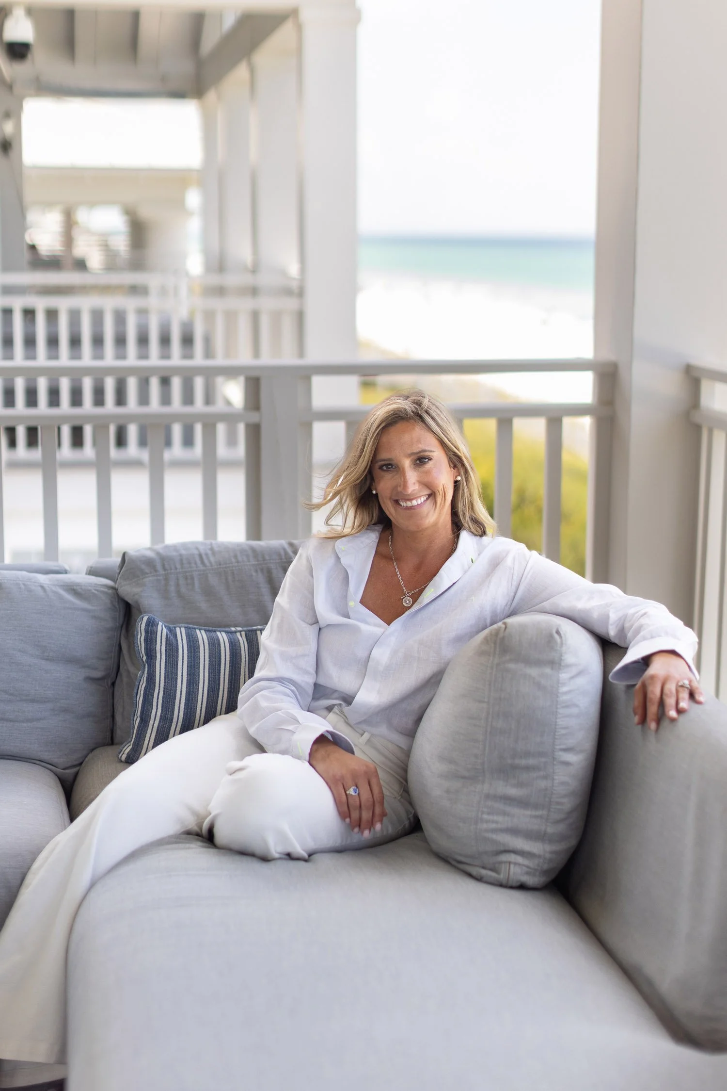 Lauren Karesh founder of renew and wellness family medicine in 30a fl sits at her desk whilst writing a script
