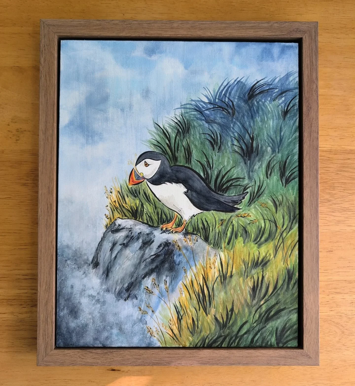 Puffin again! Puffins are becoming a staple subject 💁🏻&zwj;♀️

Size: 9x12
Medium: Watercolor &amp; ink
Surface: Wood
Loose Reference: Photograph by Janko Ferlič via Unsplash