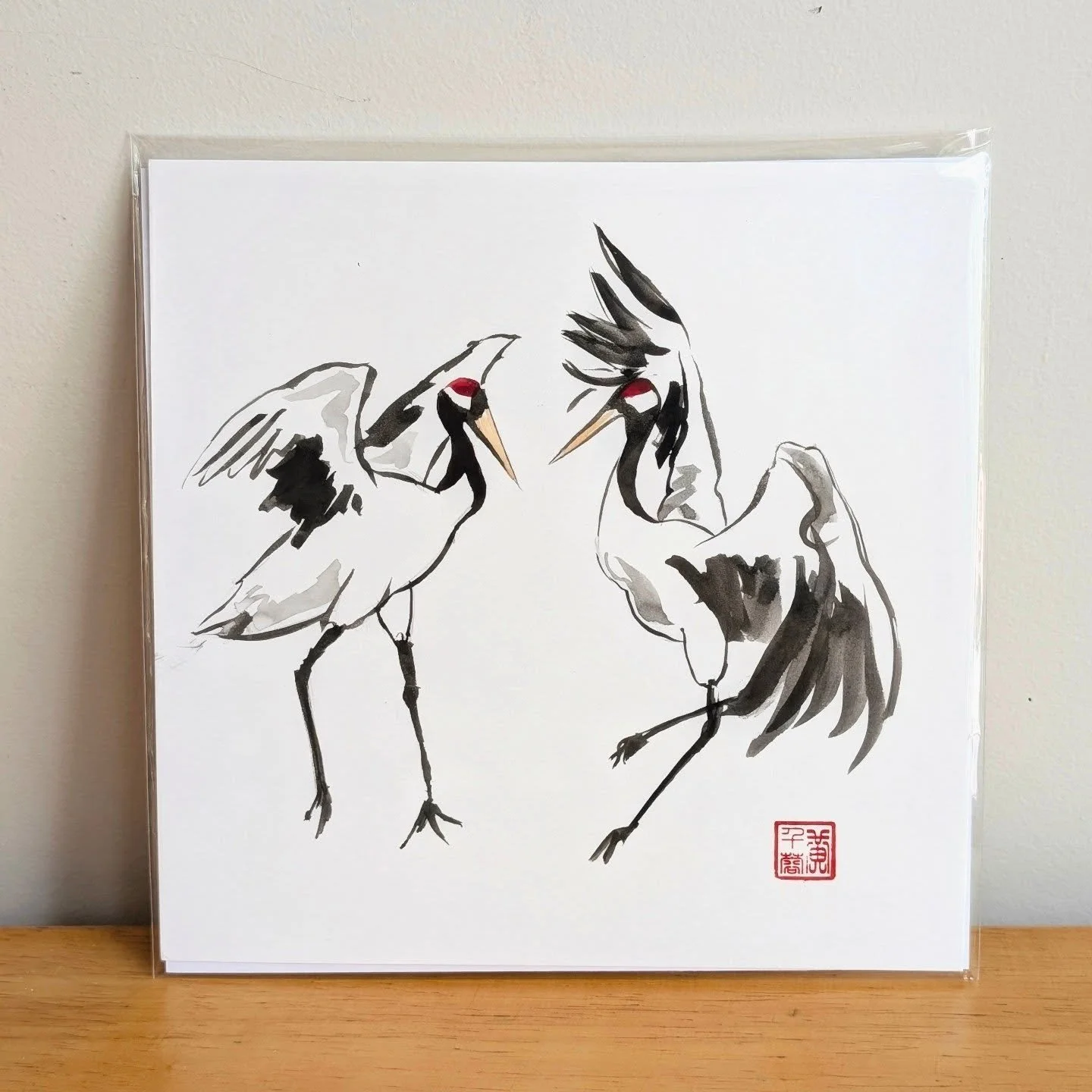 Cranes are so beautiful and elegant 🥹 When I'm struggling with finding creativity or staring at a blank piece of paper, I go back to the red-crowned crane in ink wash style.

The other day at my last market, a woman I met showed me her tattoo of a r