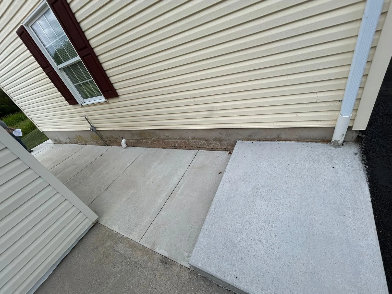 Concrete sidewalk has sunken several inches