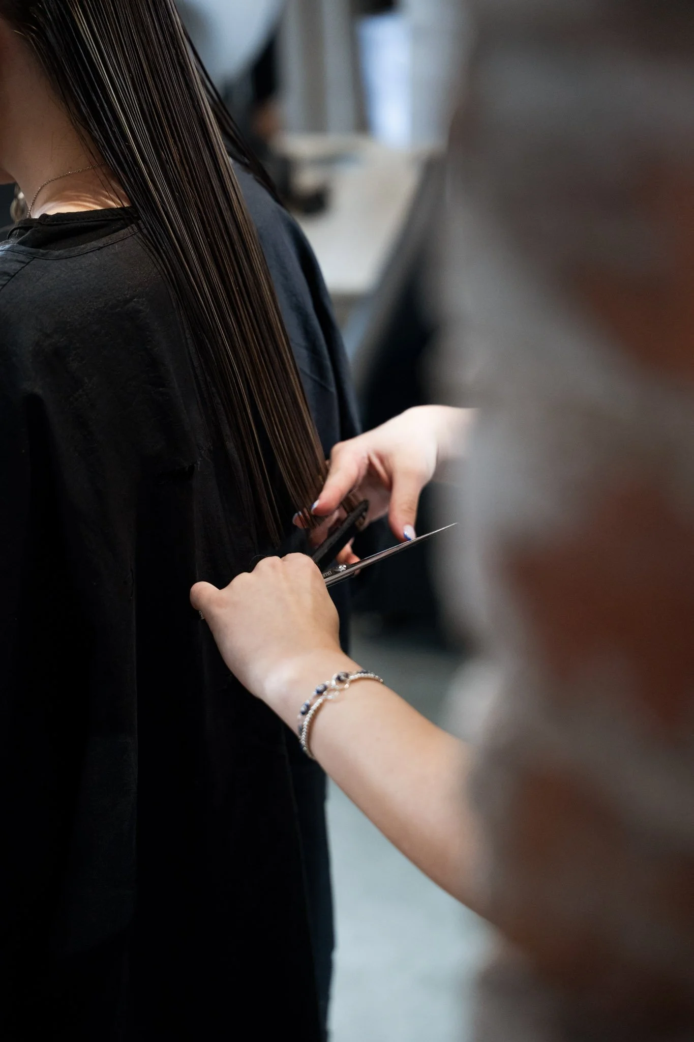 Hair being cut at Base Hairdressing in Warrington as part of video content created for the salon.