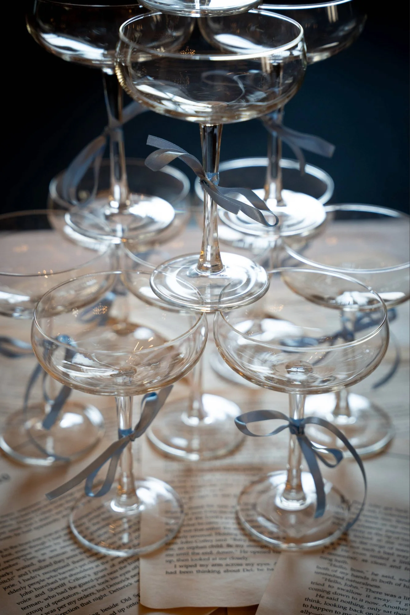 Stacked champagne glasses photographed as part of brand content creation.