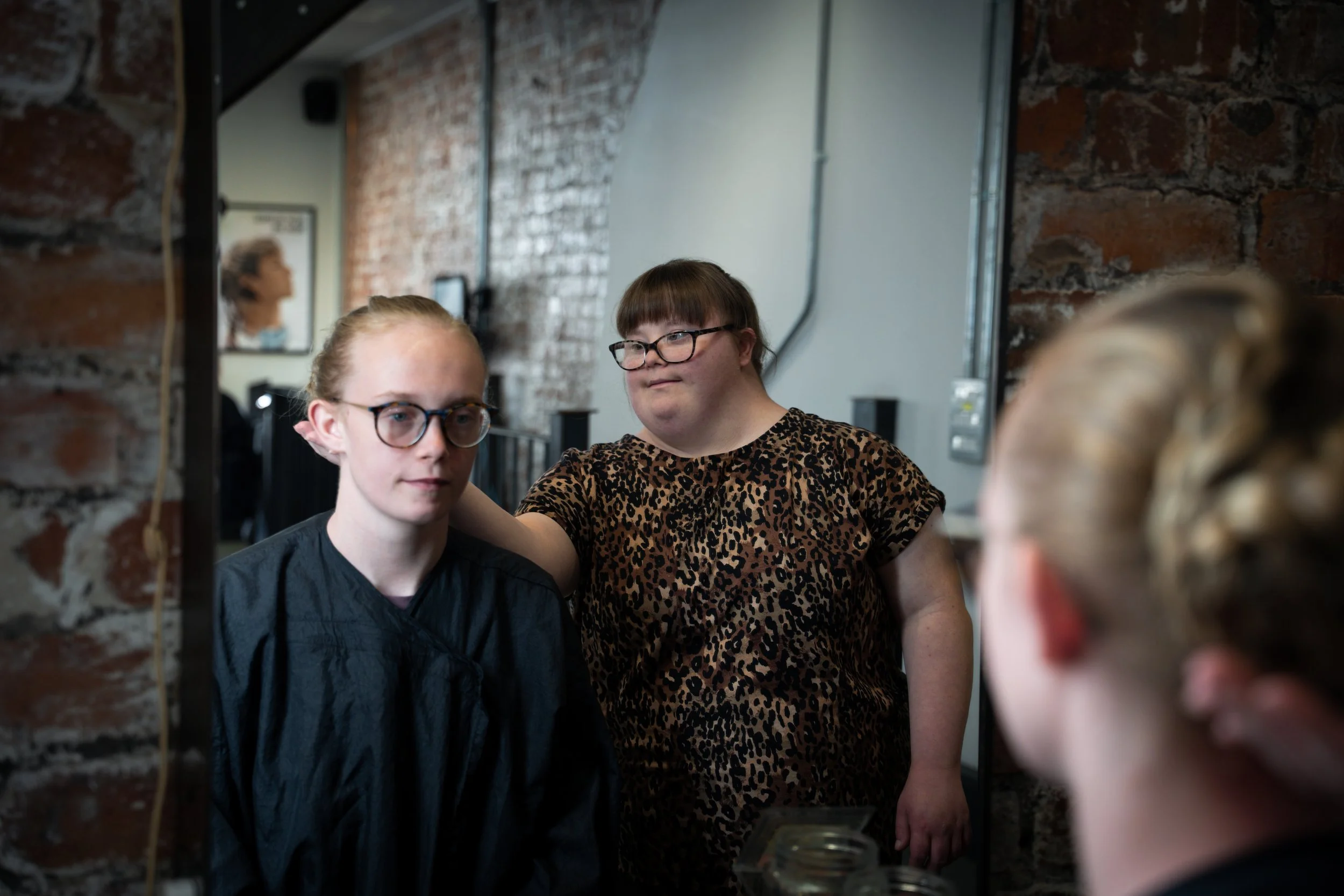 Portrait of Eve at Base Hairdressing salon, featured in a viral video campaign celebrating inclusivity and authenticity in creative storytelling.