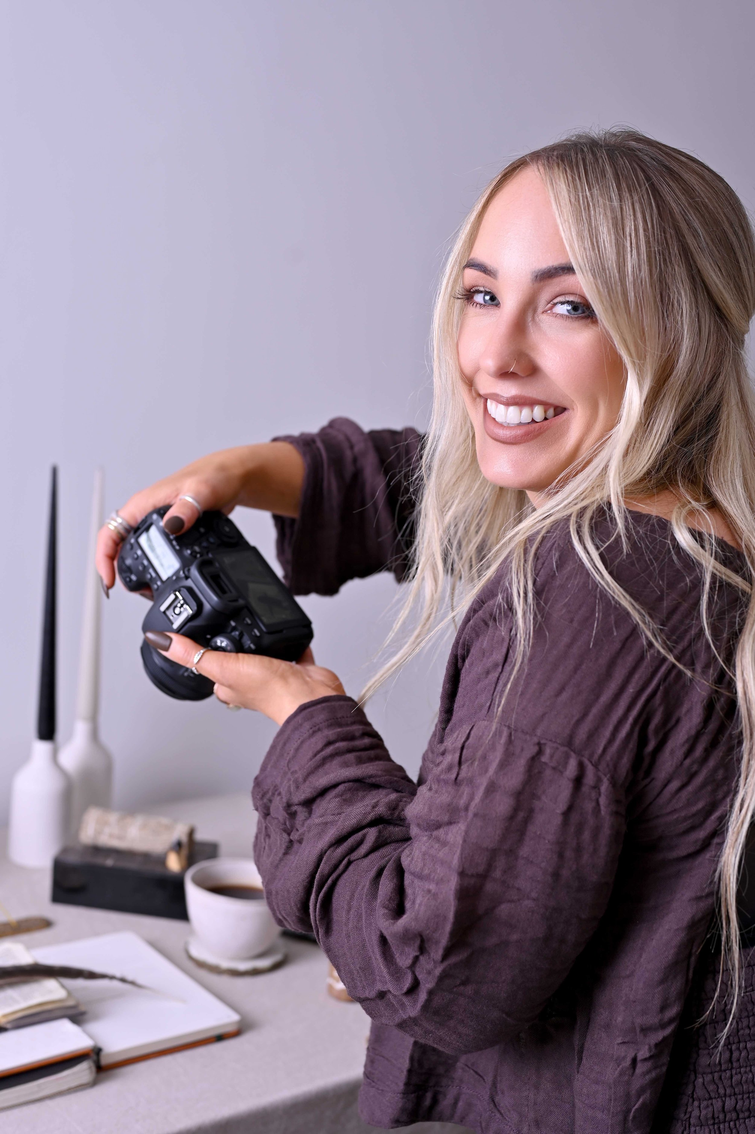 Bex photographing products in her home studio in Cheshire, creating styled imagery for a product photography shoot.