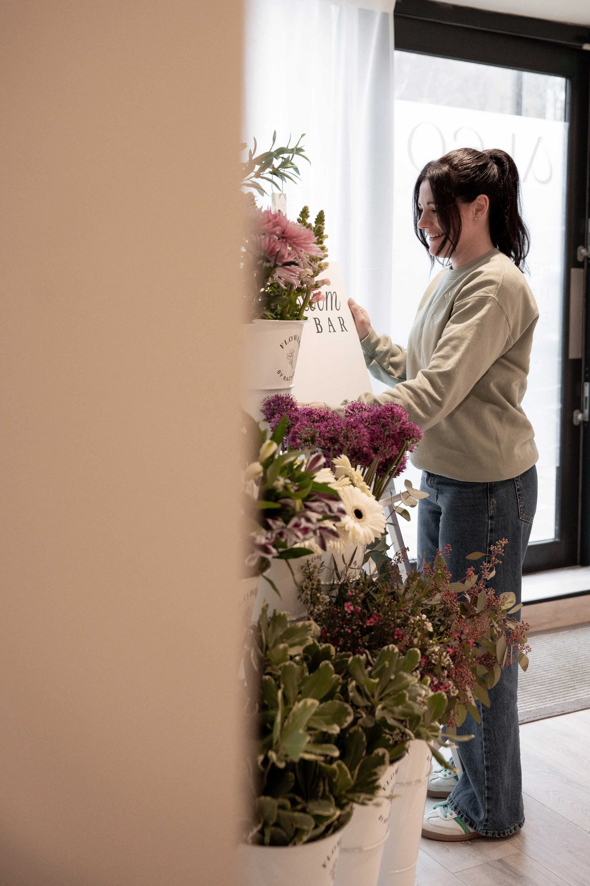 Event photography capturing a bloom bar installation in Warrington for International Women’s Day at Aleo Wellness.