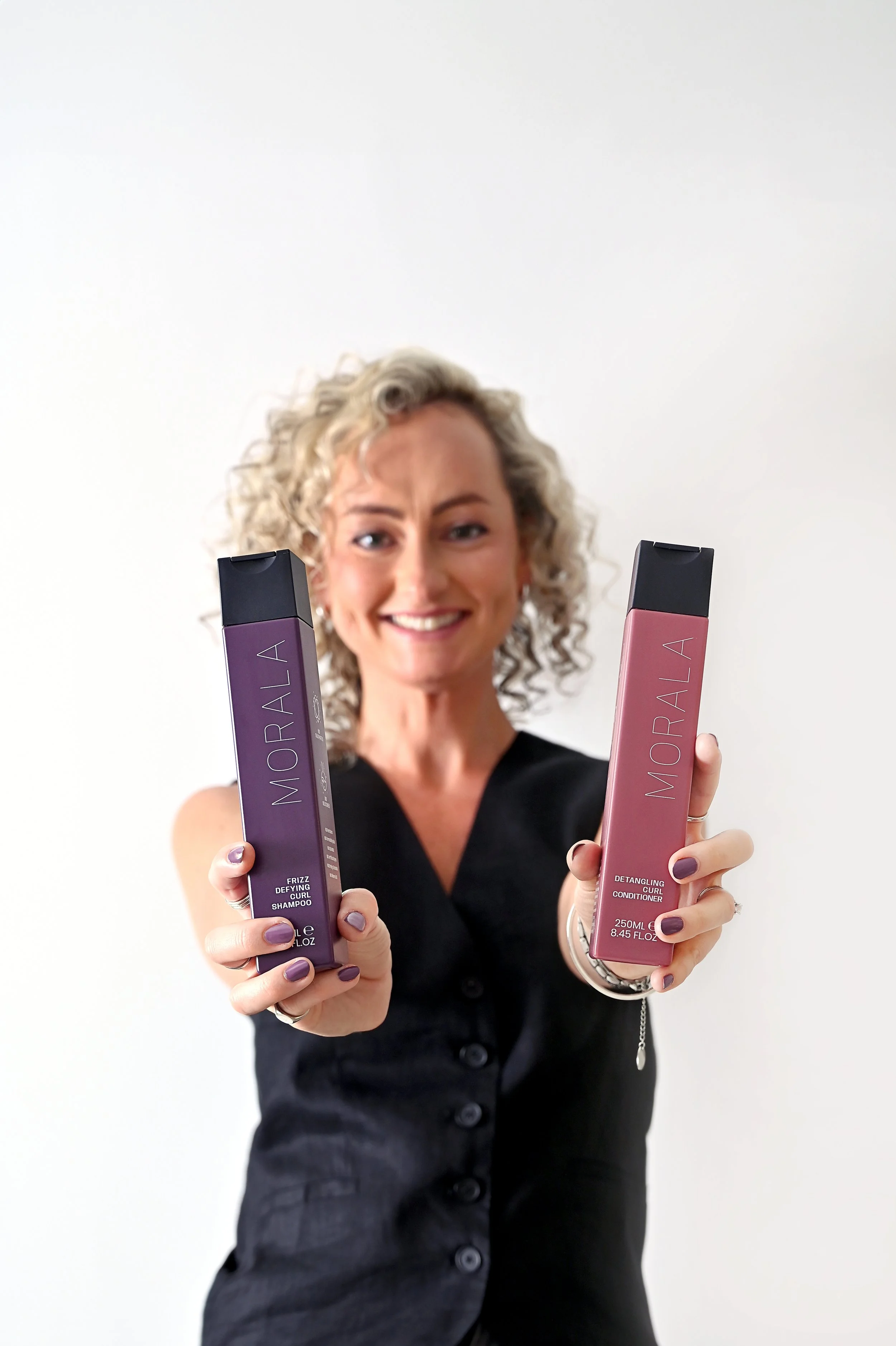 Founder of Morala Curls photographed during a brand shoot, creating natural imagery for her curly hair product brand.