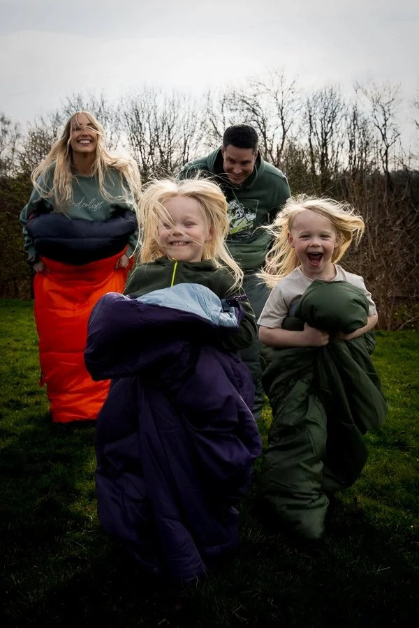 Family outdoors wearing Mountain Warehouse clothing during a lifestyle campaign shoot.