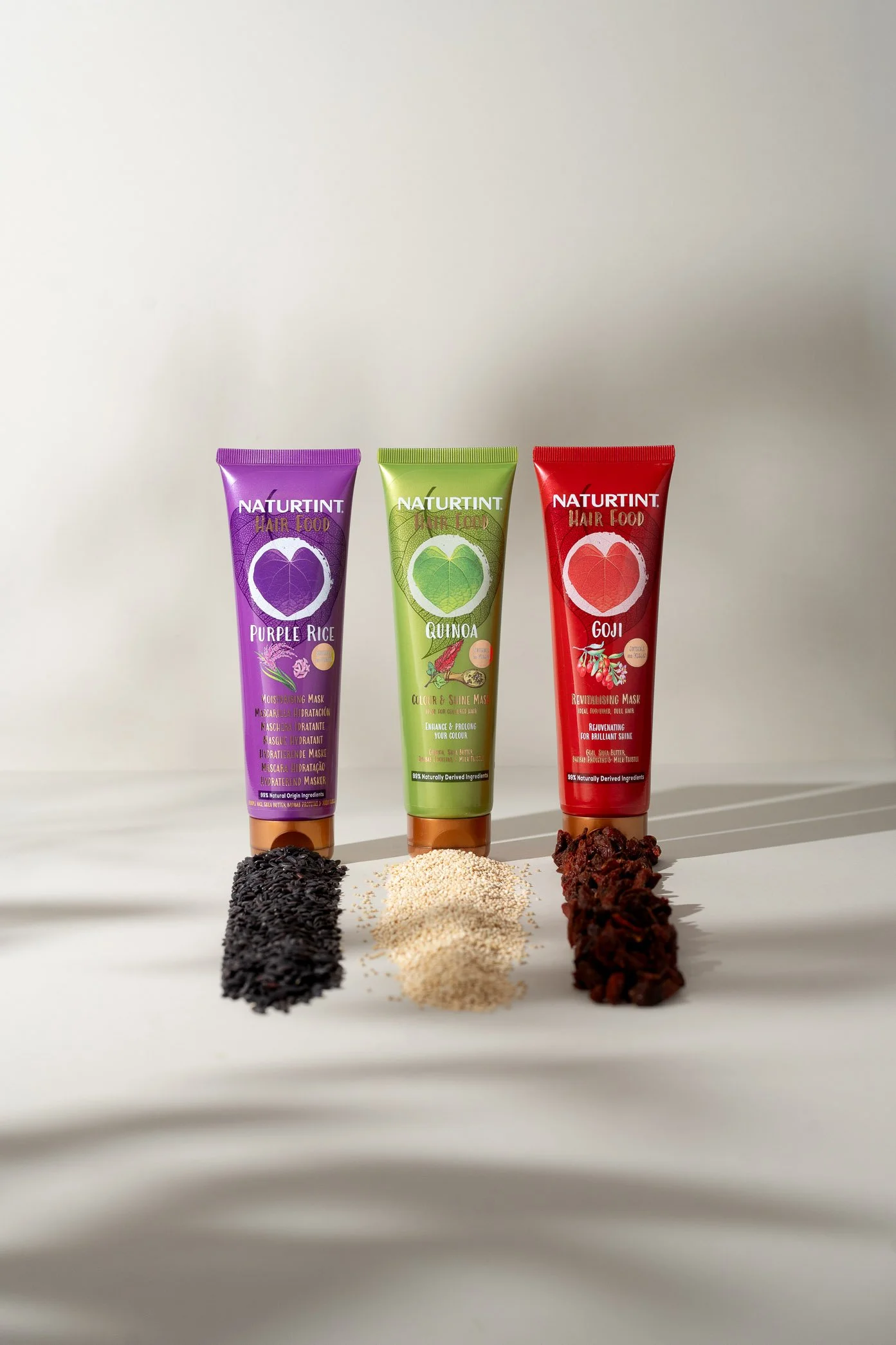 Naturtint Hair Food products photographed with purple rice, quinoa and goji ingredients