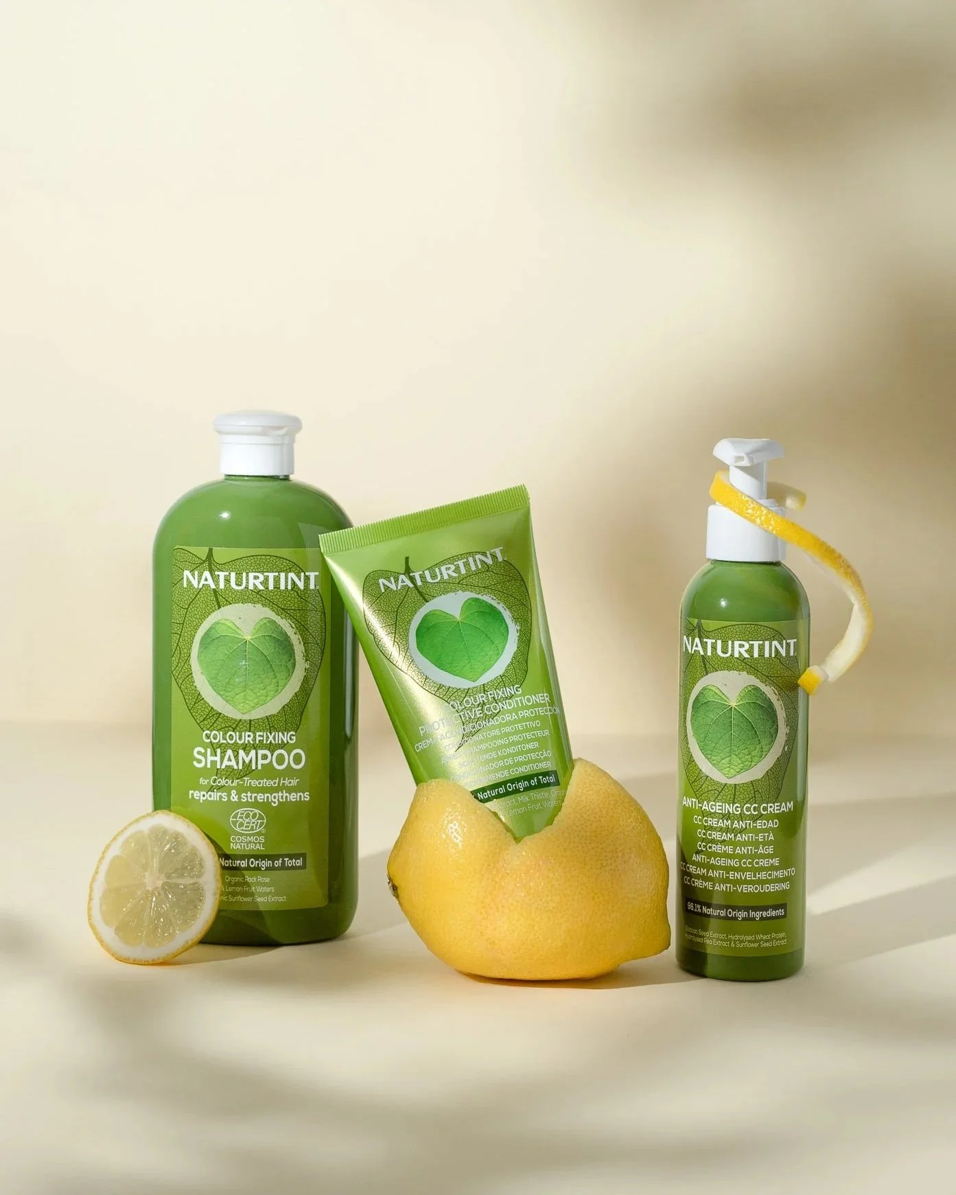 Group product photography of Naturtint haircare styled with fresh lemon and creative citrus props