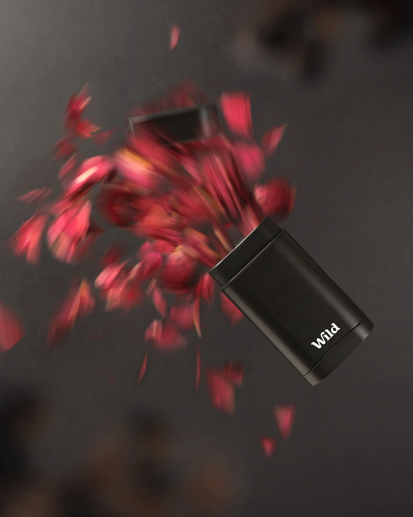 Wild deodorant photographed with red petals in a creative product photography setup