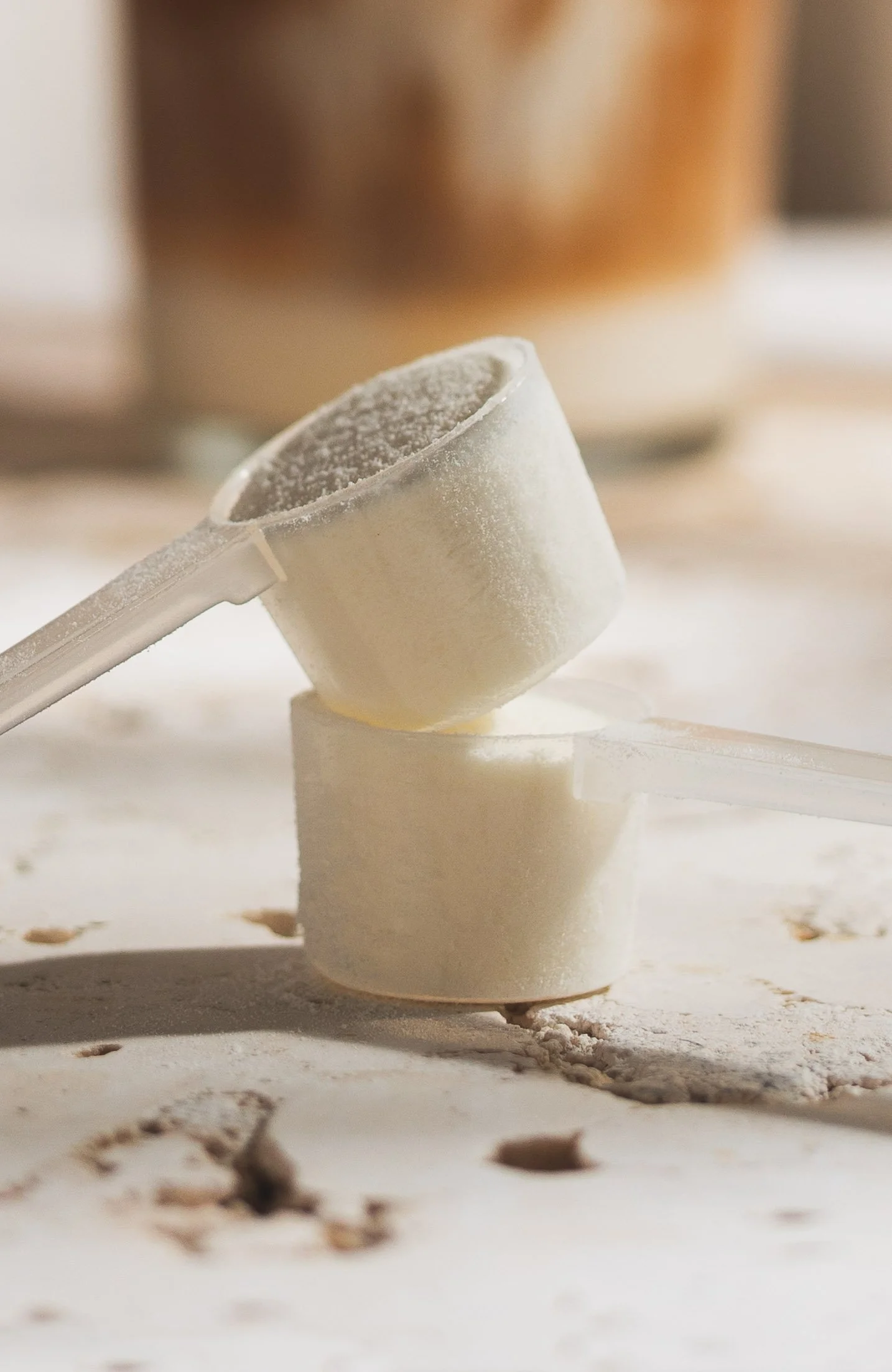 Collagen powder product photographed in a styled studio setting for product photography.
