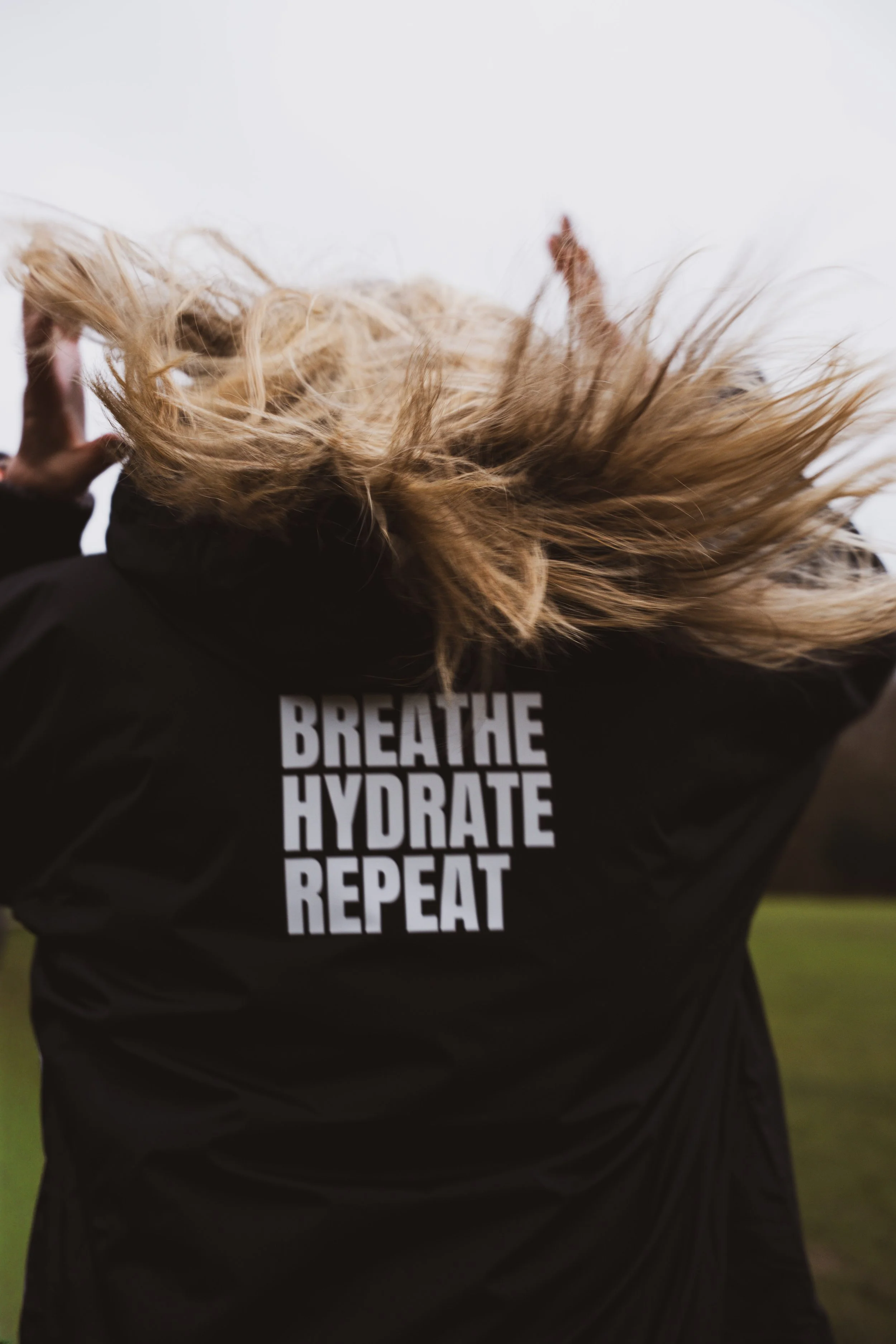 Lifestyle image of a model wearing clothing from a mental health brand, captured during a brand photography shoot.