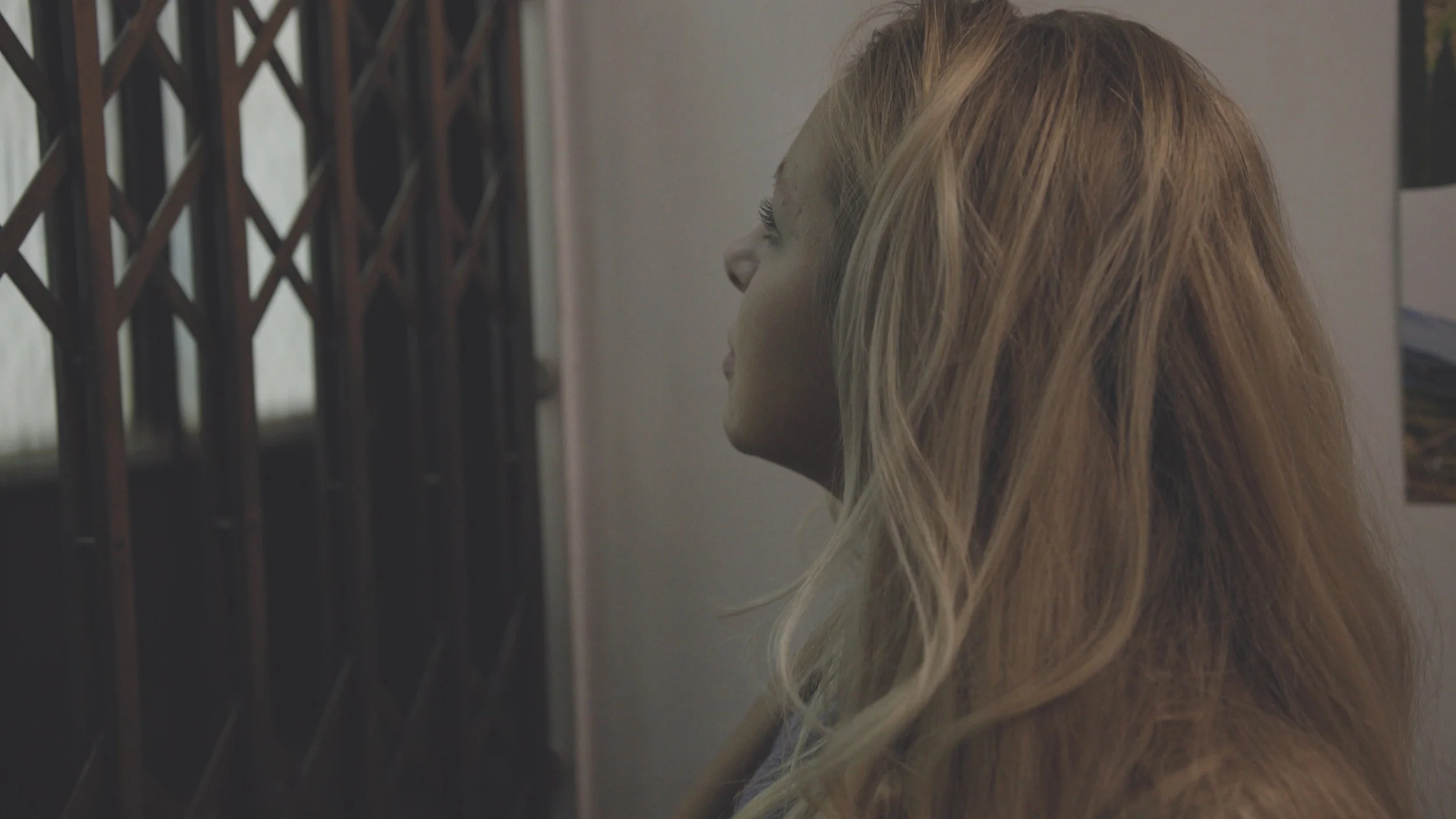 Jessica Baker in old elevator