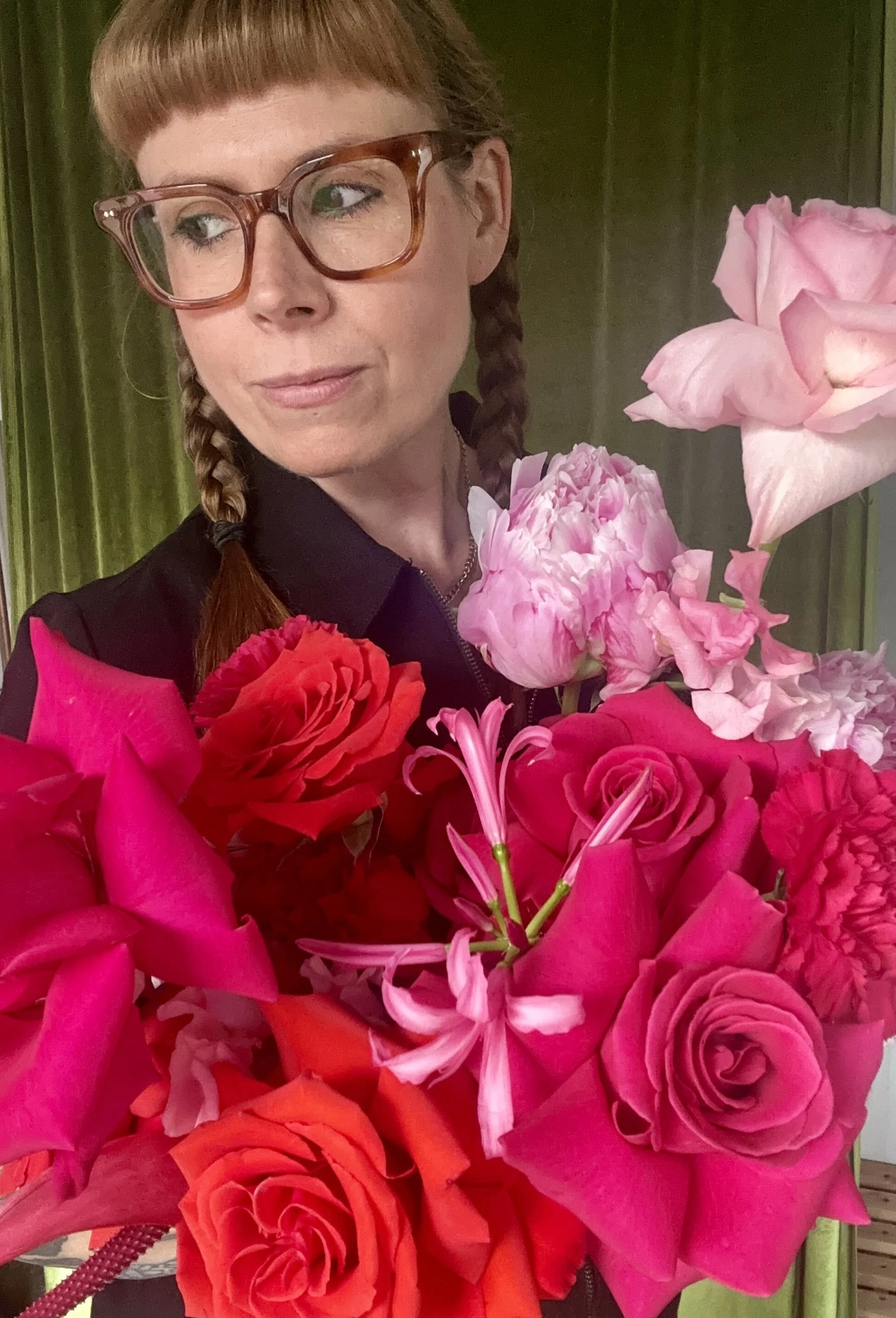 Scottish Florist holding a colourful bridal bouquet