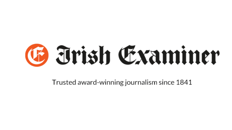 The logo of the Irish Examiner, a black and red stylized text logo.