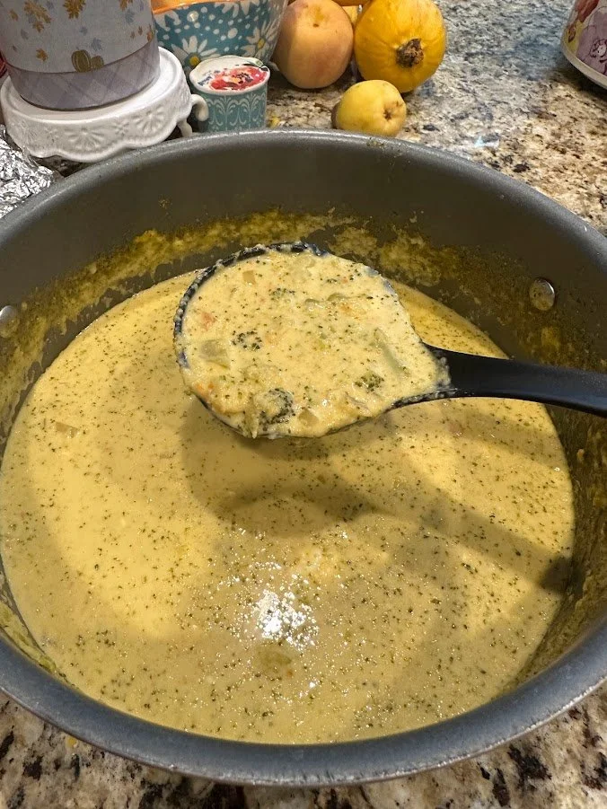 Ladle of cheddar broccoli soup.jpg