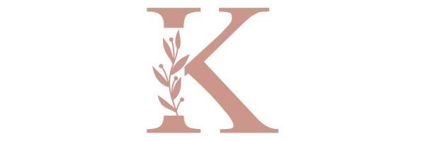 Mauve colored capital K with leaves and berries