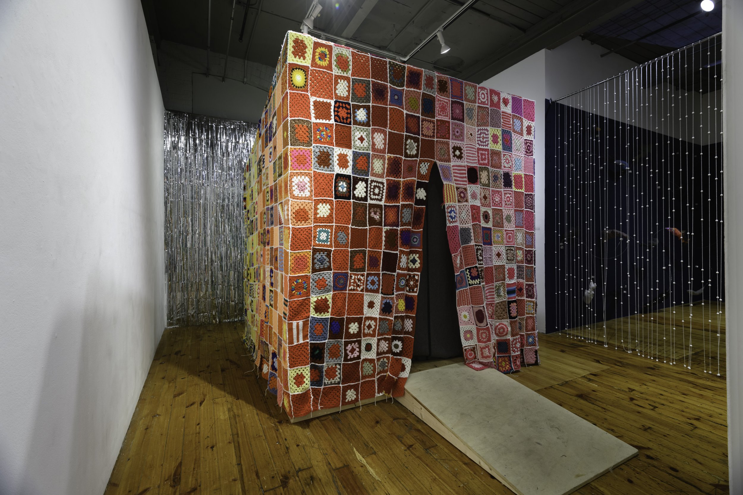 'Shelter'
8x8x8 ft. 1900 crowd-sources crochet granny squares hung over an ice fishing hut.
From 'CATCH&RELEASE' at Red Head Gallery, Toronto 2024