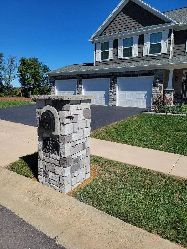 Stone mailbox in Camp Hill, PA with arched metal mailbox insert