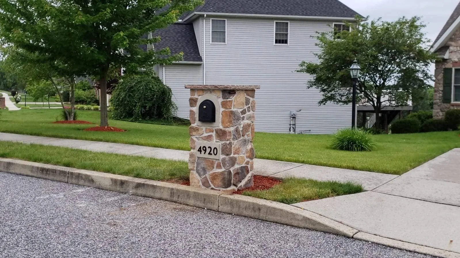Traditional stone mailbox in Camp Hill, PA with decorative cap