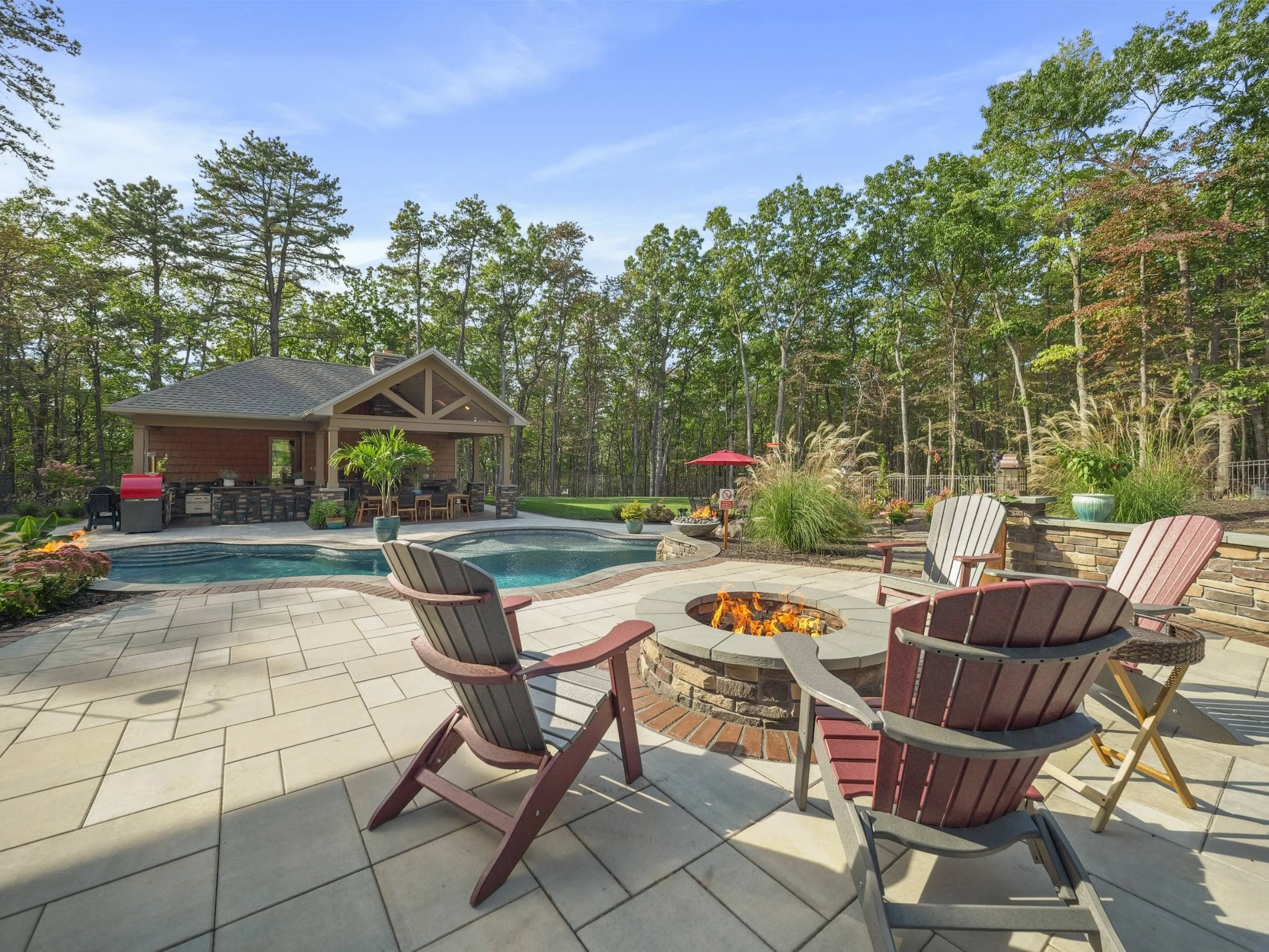 Outdoor kitchen and fireplace by professional landscaping company in Carlisle, PA