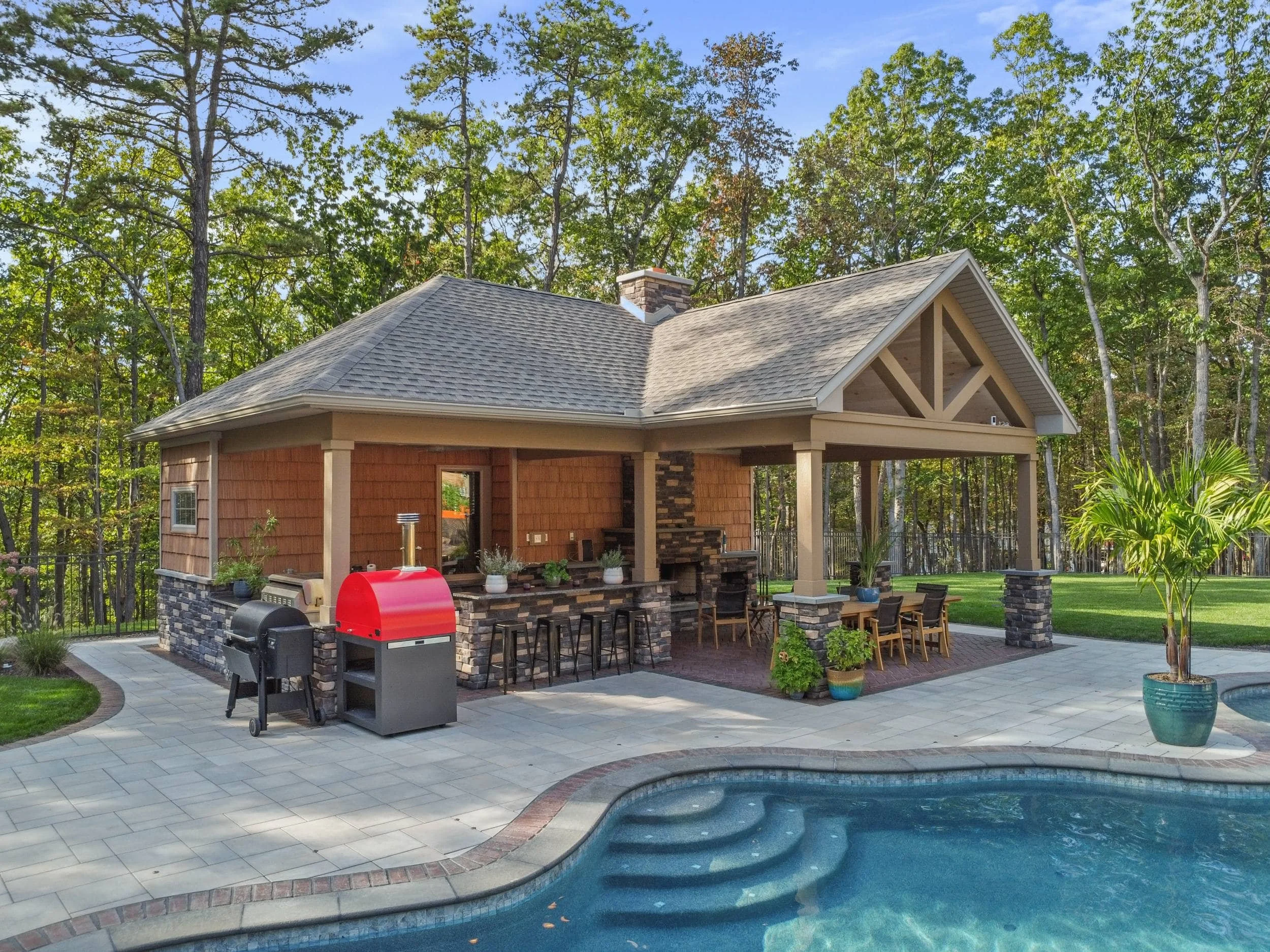 Covered pavilion and lighting design by Weaver’s Landscape Company in Mechanicsburg, PA
