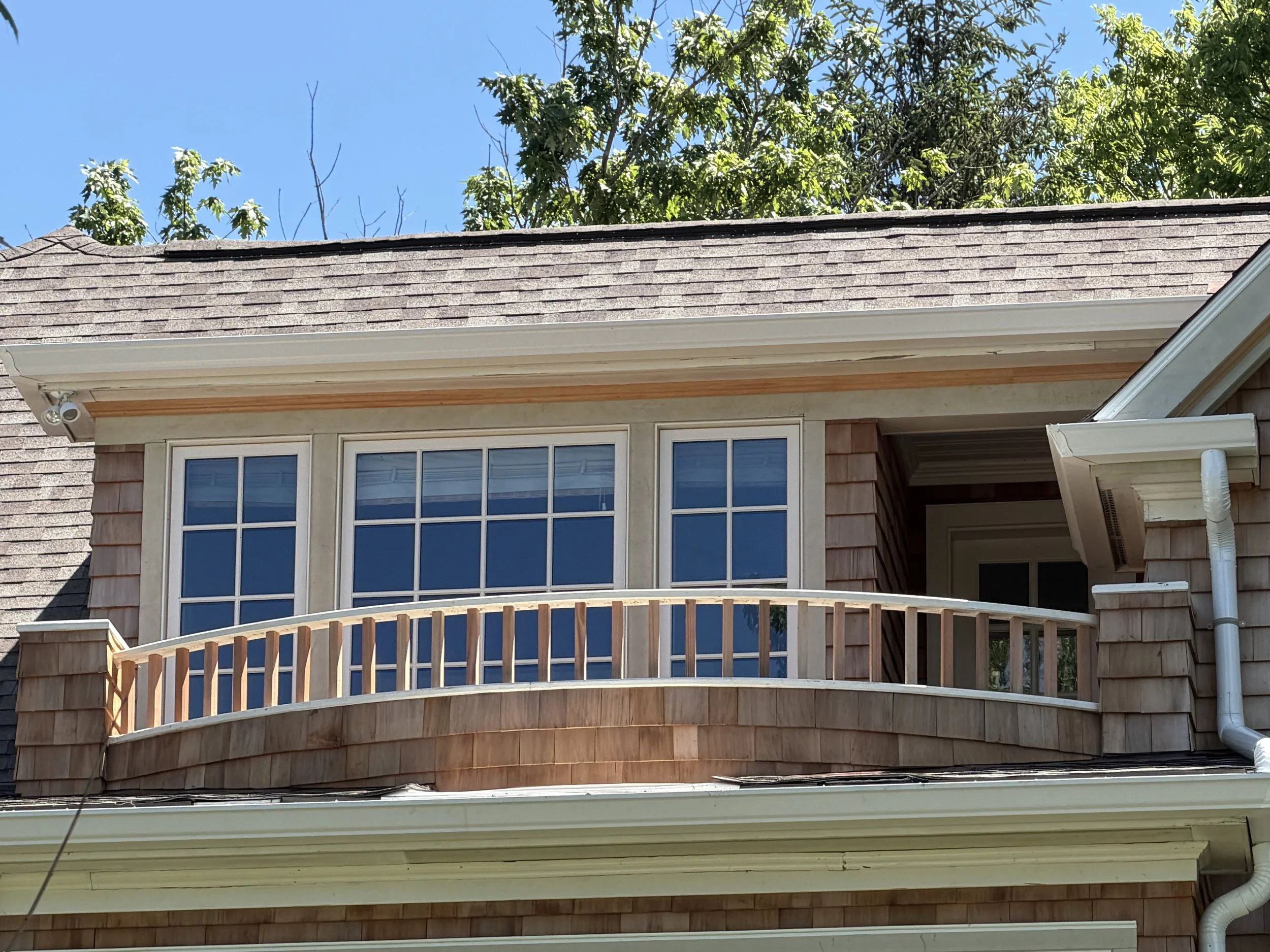 Curved Ipe Deck with Cedar Shake Siding: A Norcross Builders Lakeside Project