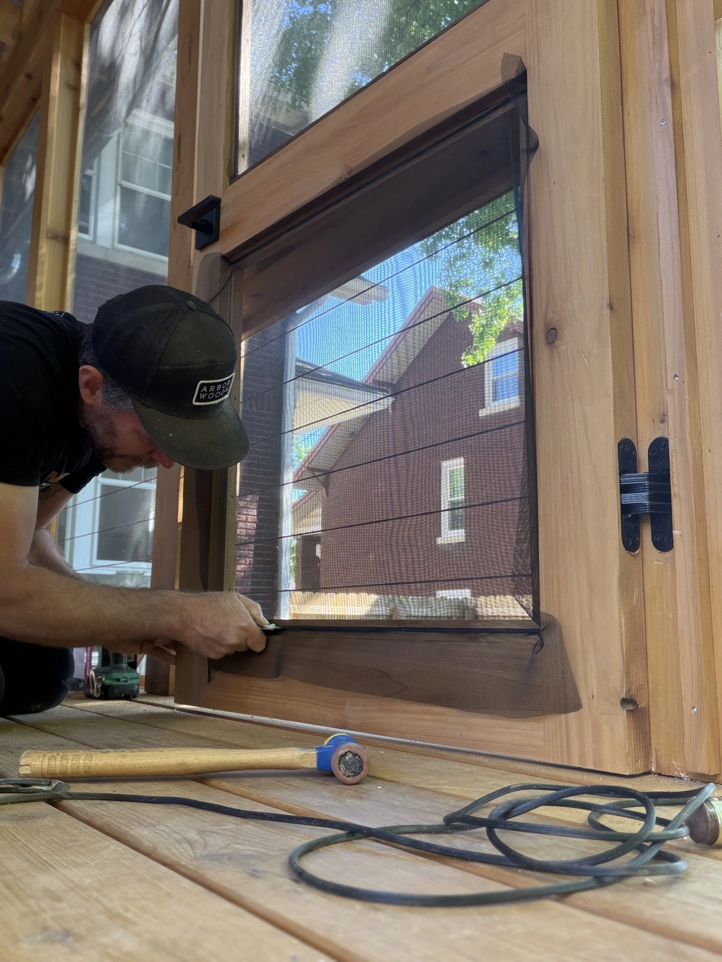 Gabe Norcross of Norcross Builders is a general Contractor in Louisville doing carpentry work on a porch
