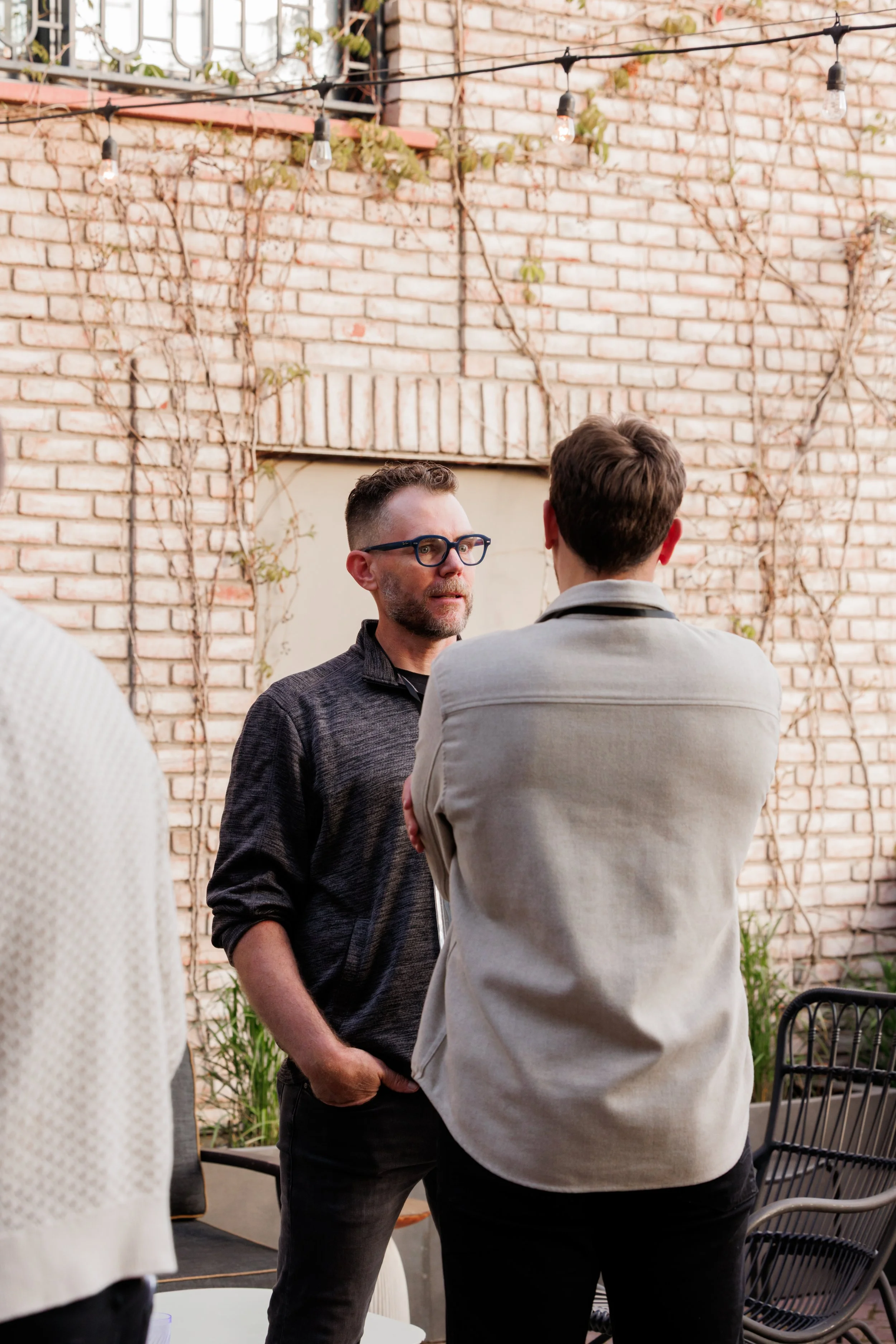 photo of Gabe Norcross, general contractor in Louisville speaking to an industry partner