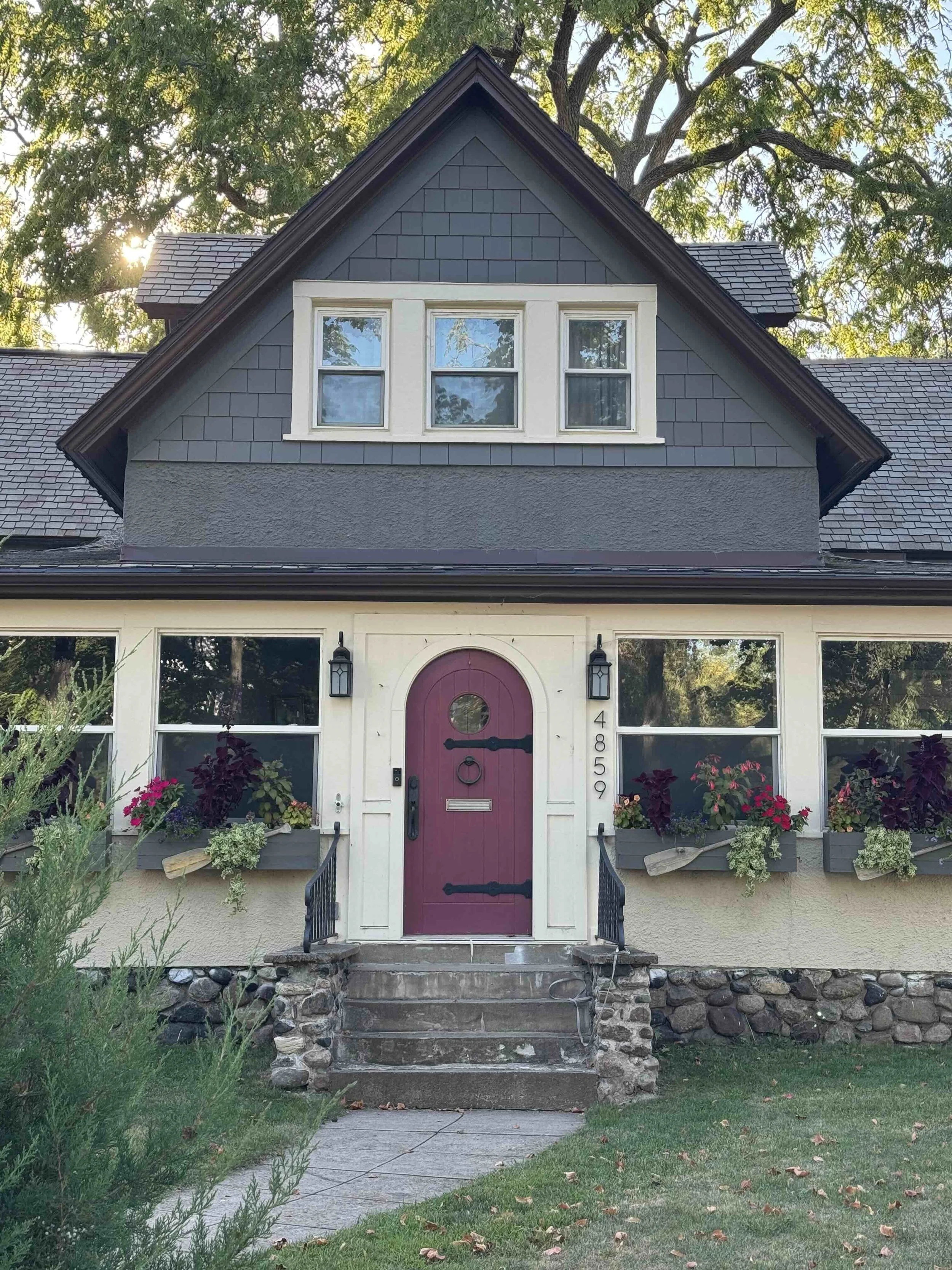 beautiful house exterior with an arched red front door