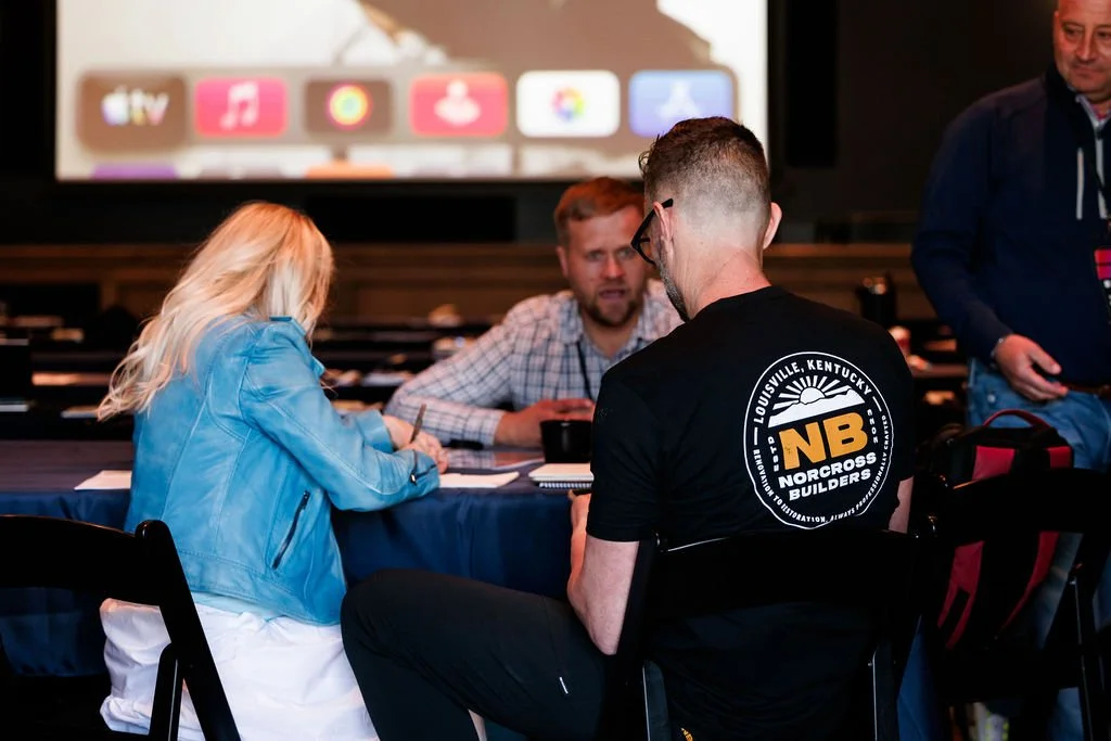 Gabe Norcross is meeting with Noah Bergland of Owl Roofing and Anya Bergland of Neon Lion Media at Contractor Coalition Summit