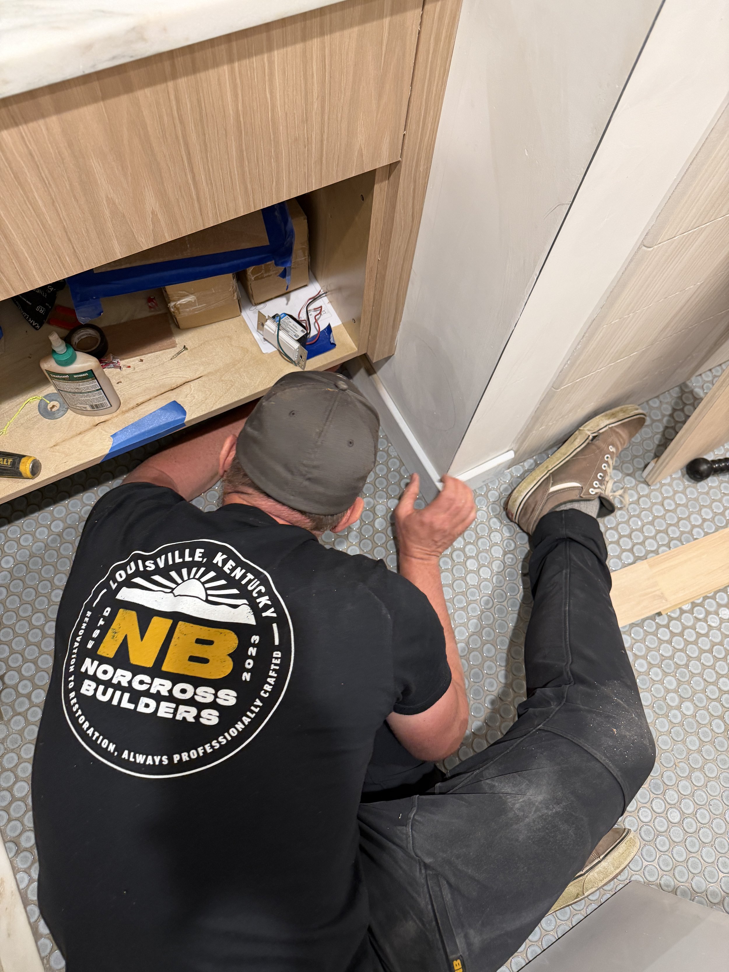 Gabe Norcross is installing single bathroom vanity at A Custom Home in Louisville, KY