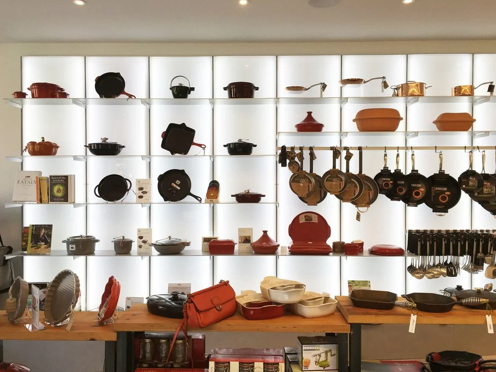 Lit steel, steel and wood shelving and point of sale at Artichoke in Cincinnati, Ohio. Solstice's Shay Myers in collaboration with Cincinnati architect, Terry Boling.