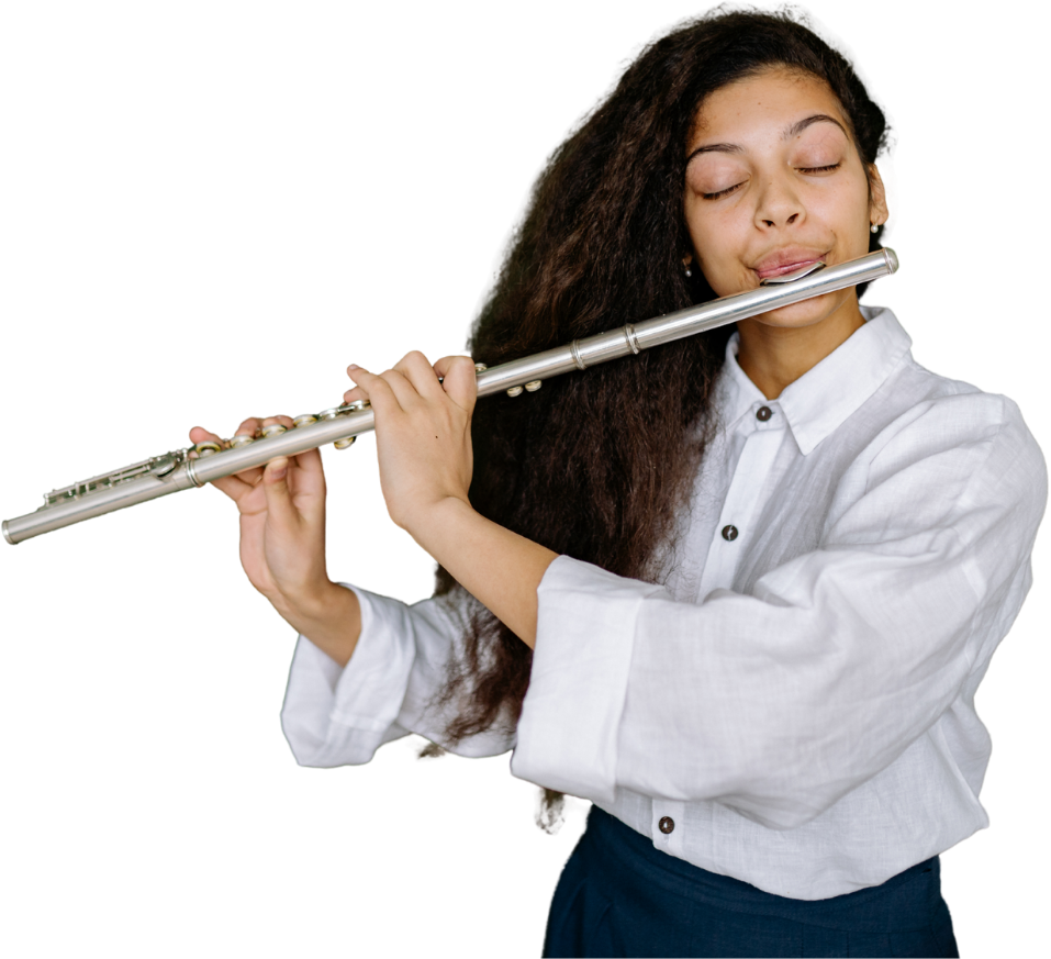 A young woman with long curly hair playing a silver flute with her eyes closed.
