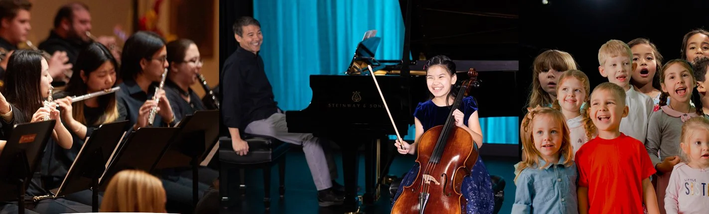 Violinist smiling on stage with pianist in background