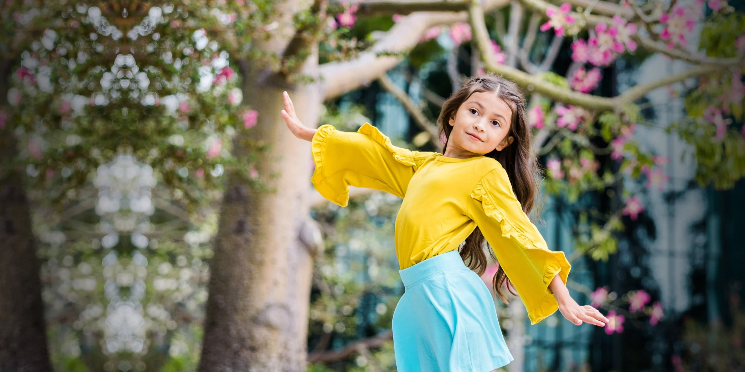 Little girl Dancing in a garden