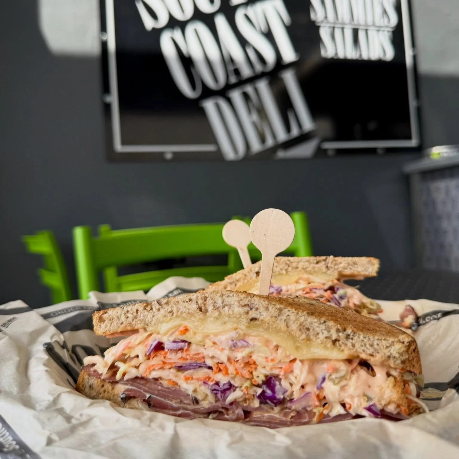 Named after deliboy&rsquo;s beautiful side kick, the Dar&rsquo;s Sky High is piled high with pastrami, melted swiss cheese, thousand island &amp; coleslaw on rye
