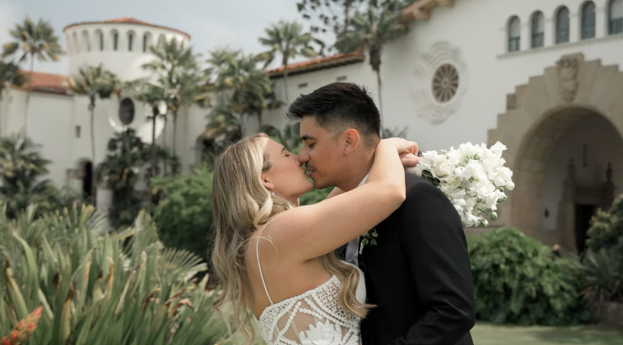 Santa Barbara wedding videographer filming an outdoor ceremony
