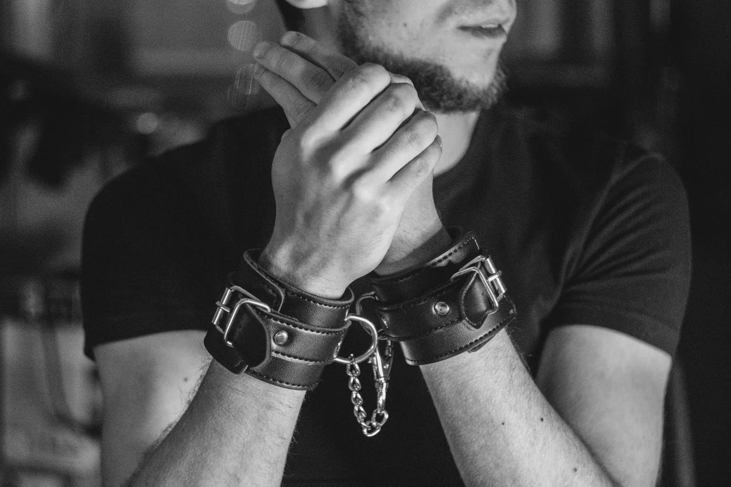 Bearded man in leather cuffs