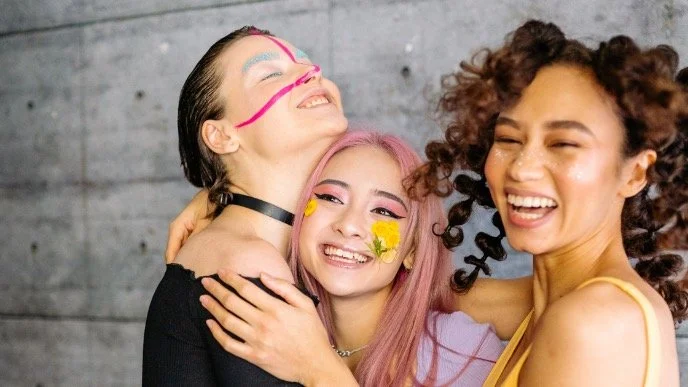 poly couple hugging and smiling