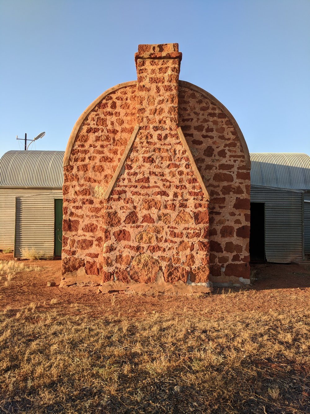  Shearers mess fireplace, local stone and curved corrugations 