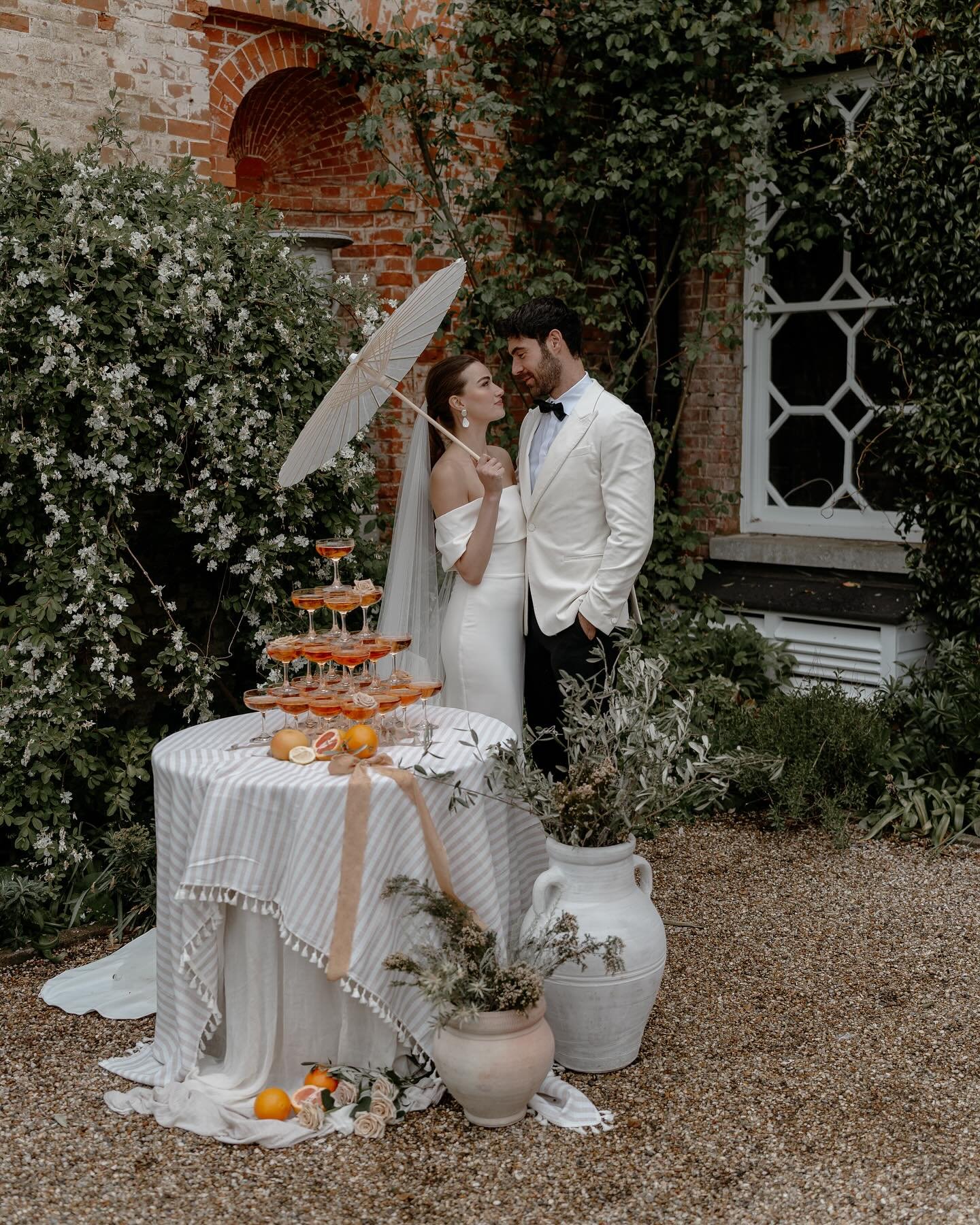 Italian dream 🤍 

All of the inspiration you need for your Italian destination wedding&hellip; Sunshine, Aperol champagne tower, parasol, luxury modern wedding gown and a light suit! 

Super excited for my destination weddings this year, I&rsquo;m h