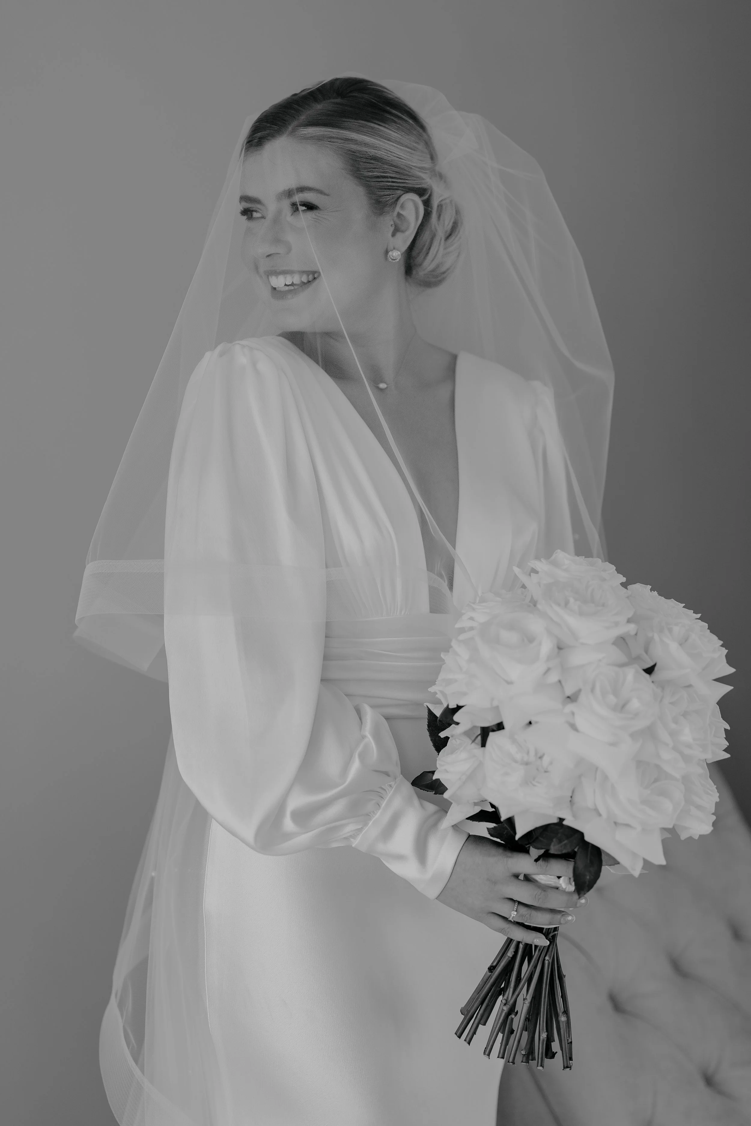 Black and white image of bride smiling