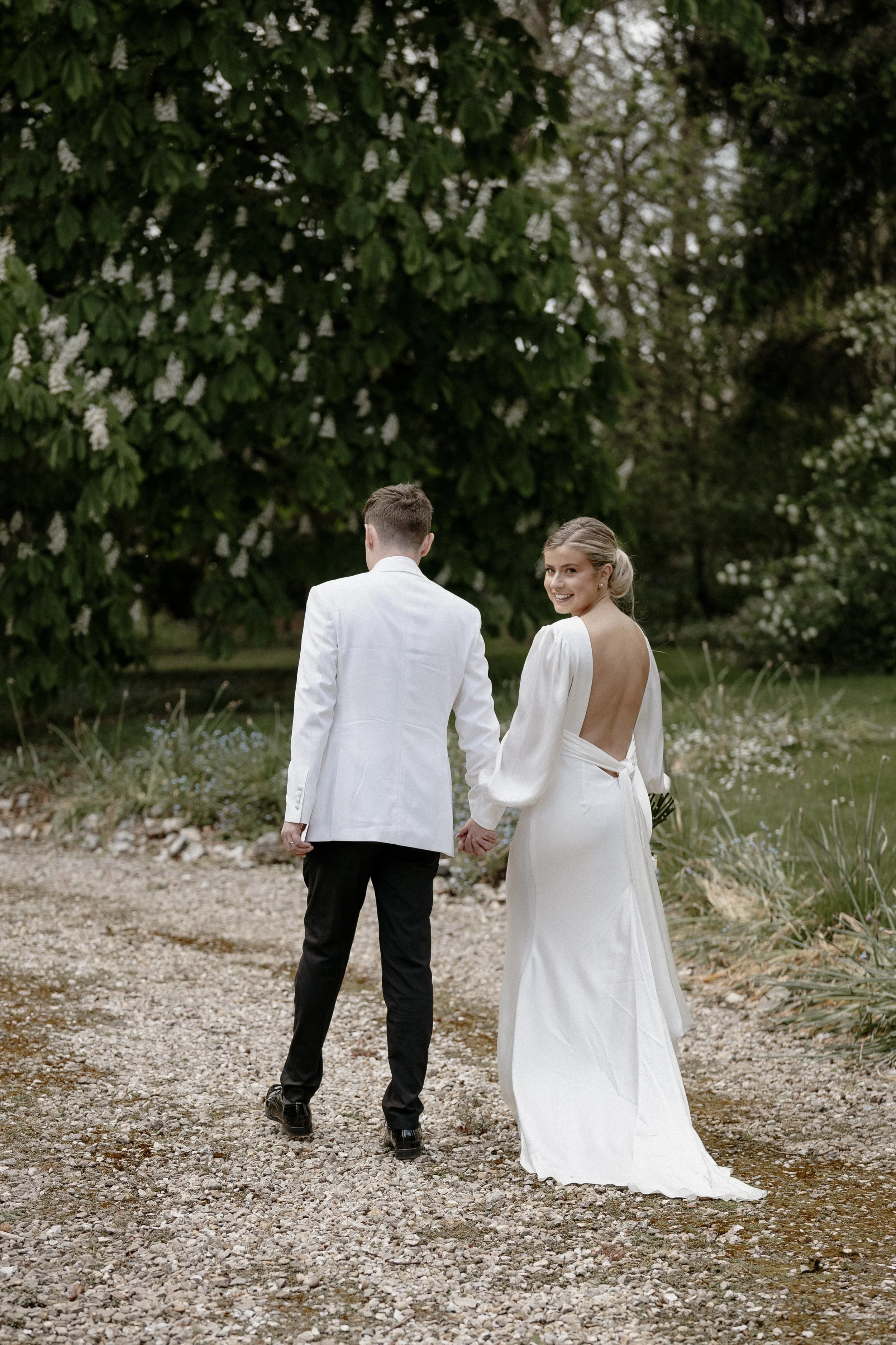 Bride and groom walking away