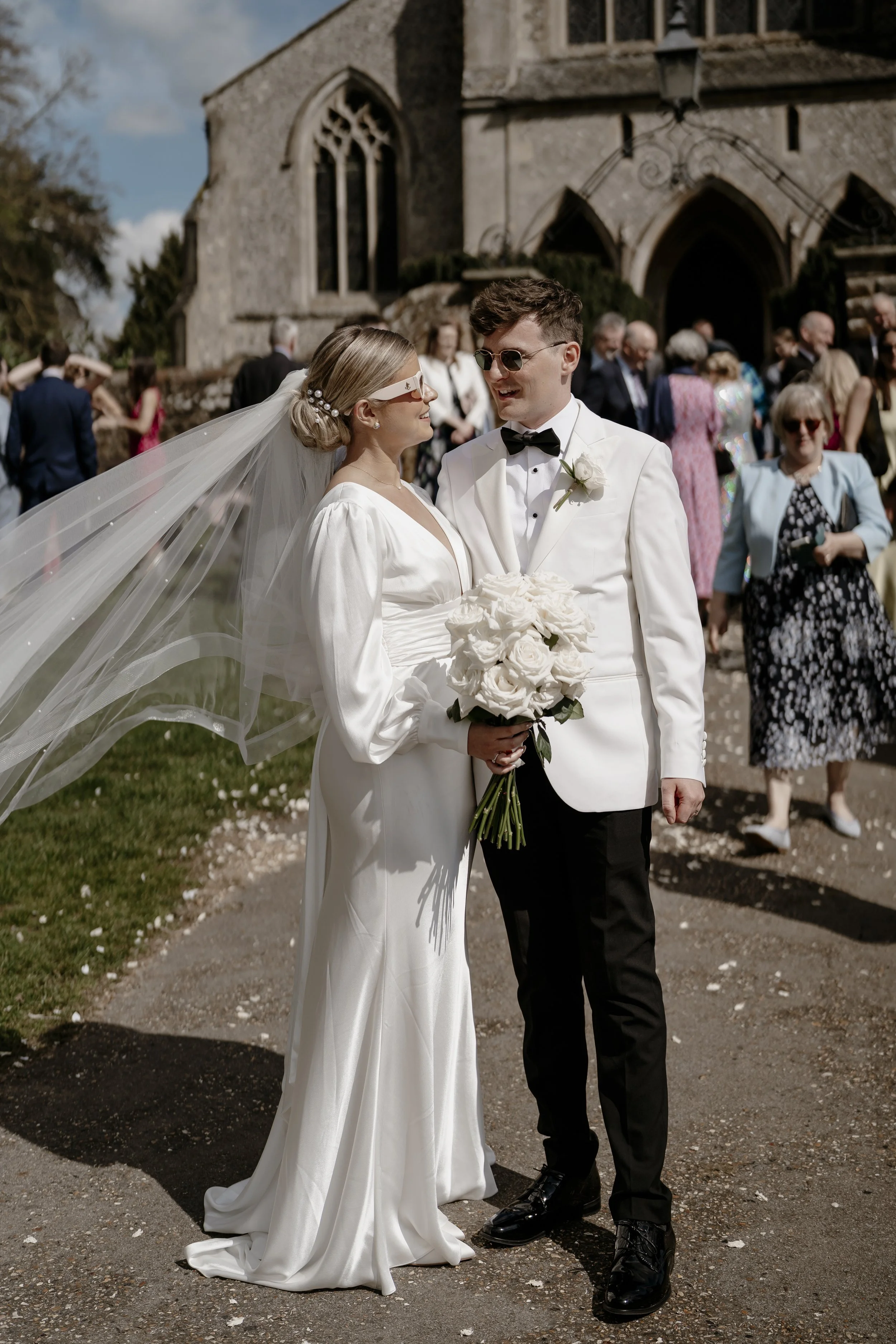Bride and groom smiling at each other