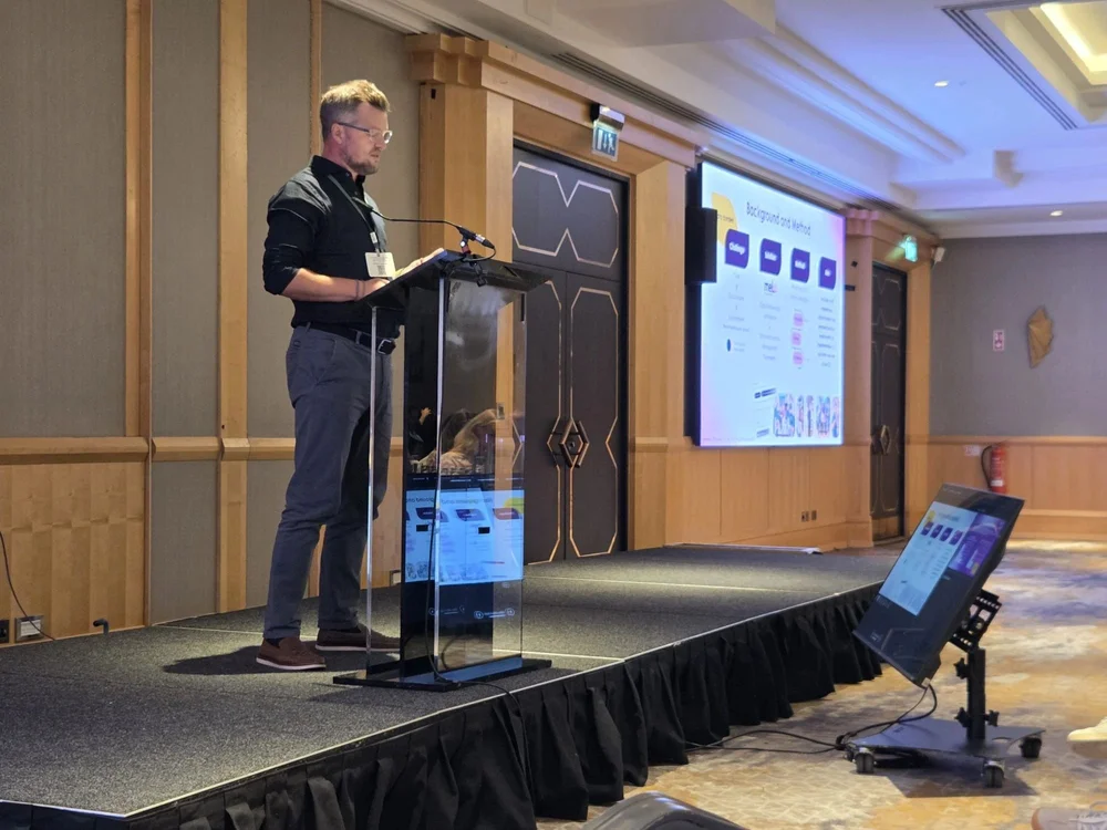 James Chapman, Melo co-founder, presenting the Royal Hospital evaluation at NR-SIG-WFNR in Belfast, July 2026