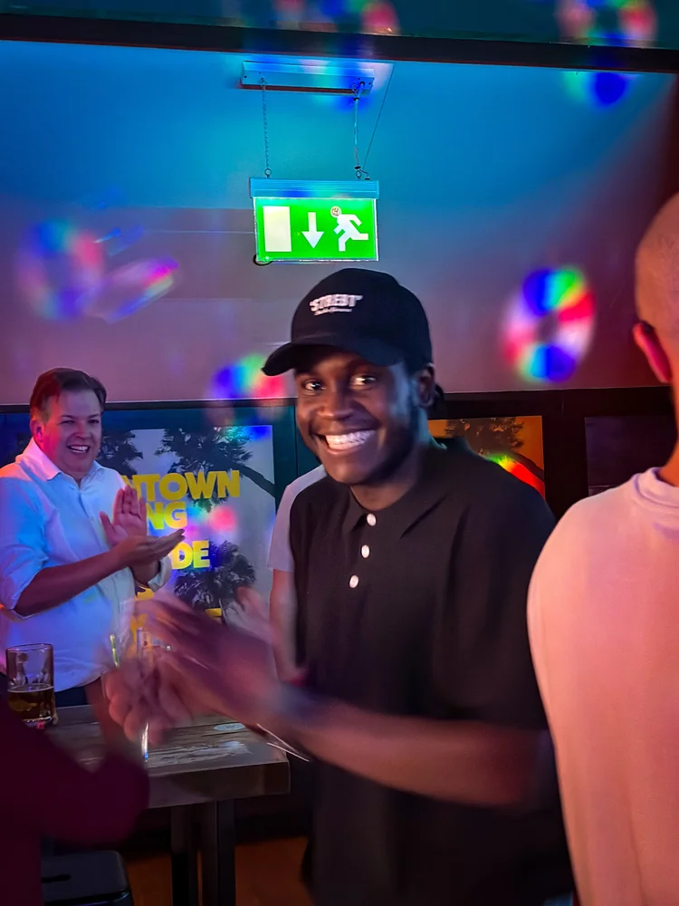 A team member smiling at a team night out